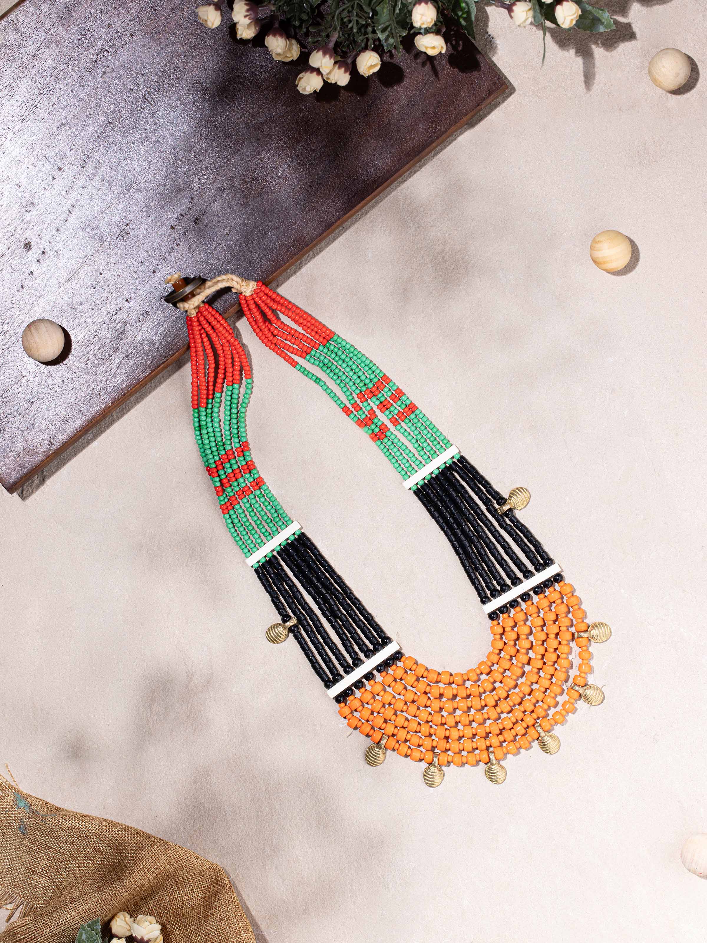 Side view of Beads & Faux Bones Long Necklace emphasizing its long length and unique design.