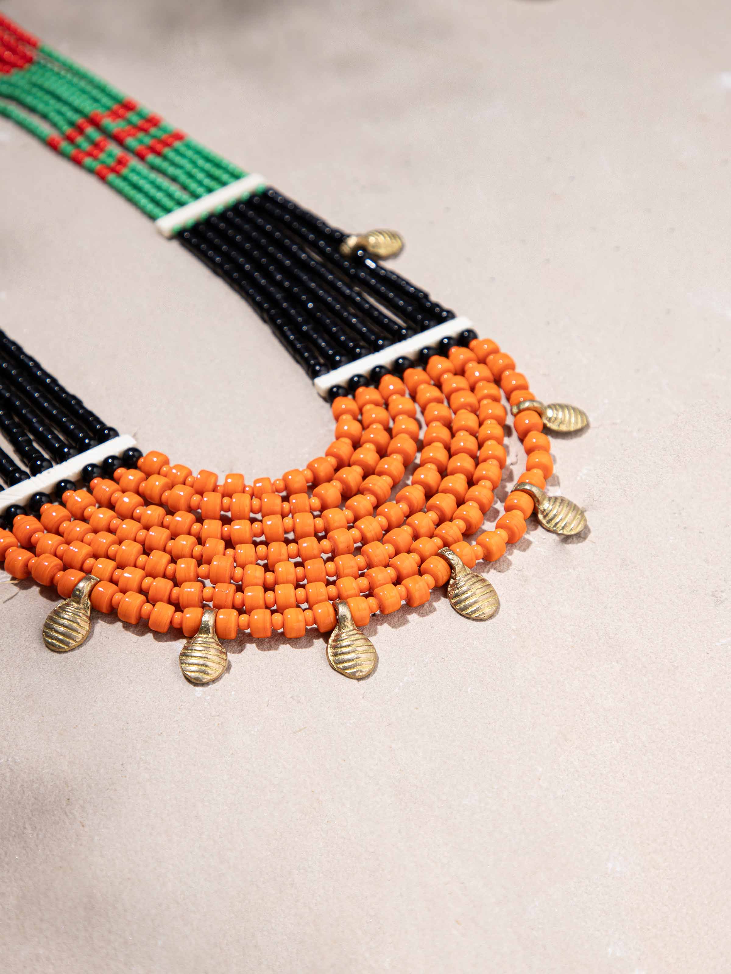 Back view of Beads & Faux Bones Long Necklace displaying its clasp and overall design.