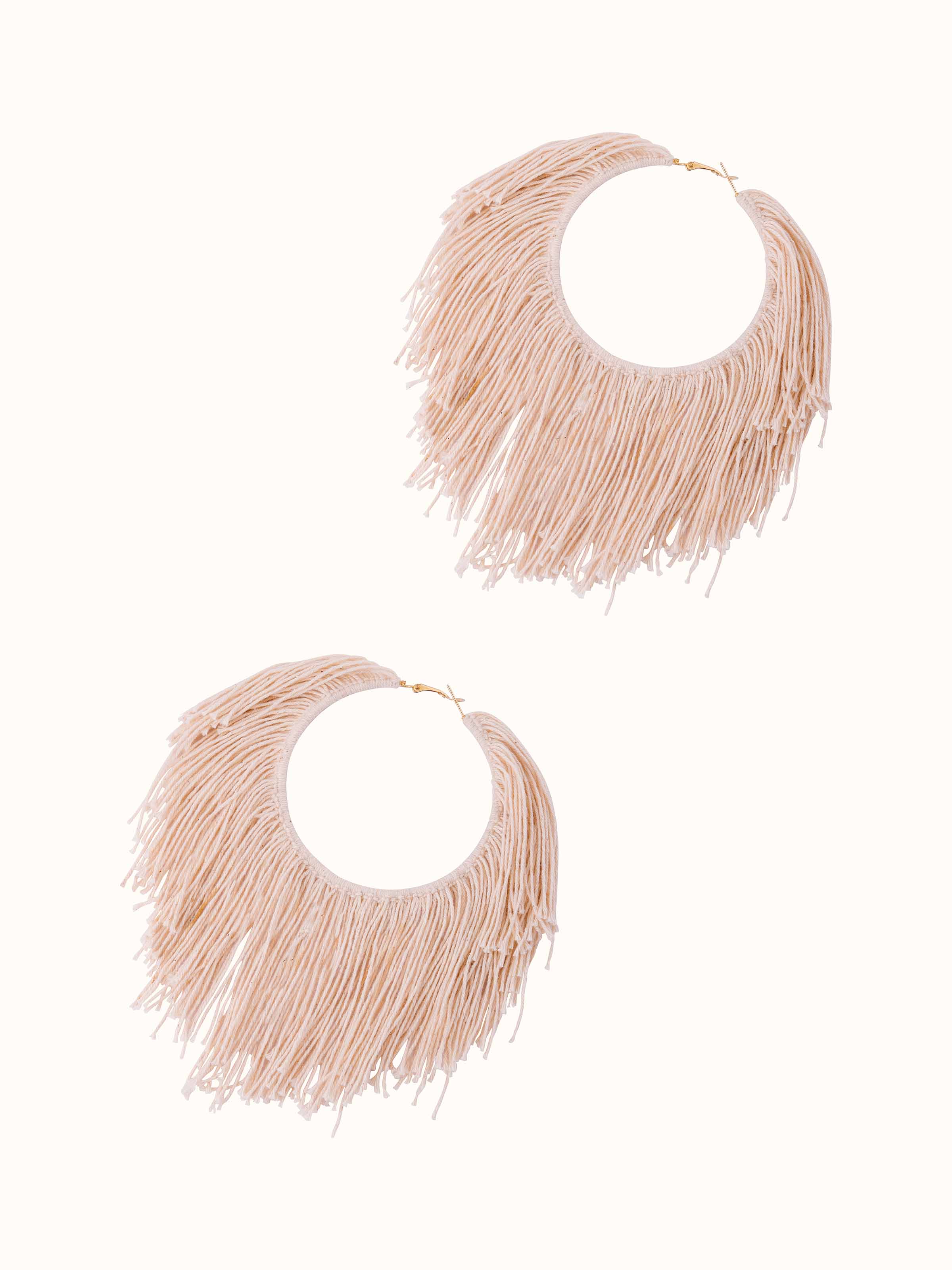 Angled view of Cotton Chord Hoops displaying the elegant curvature.