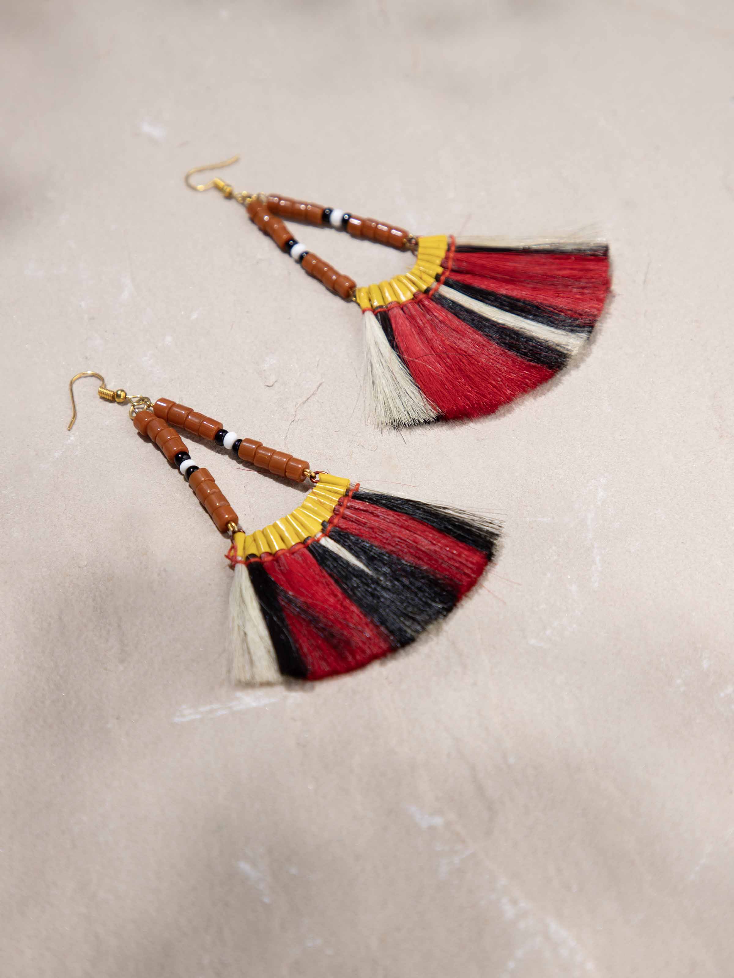 Detailed view of Bead & Dyed Goat Hair Drop Earrings highlighting the craftsmanship and color richness