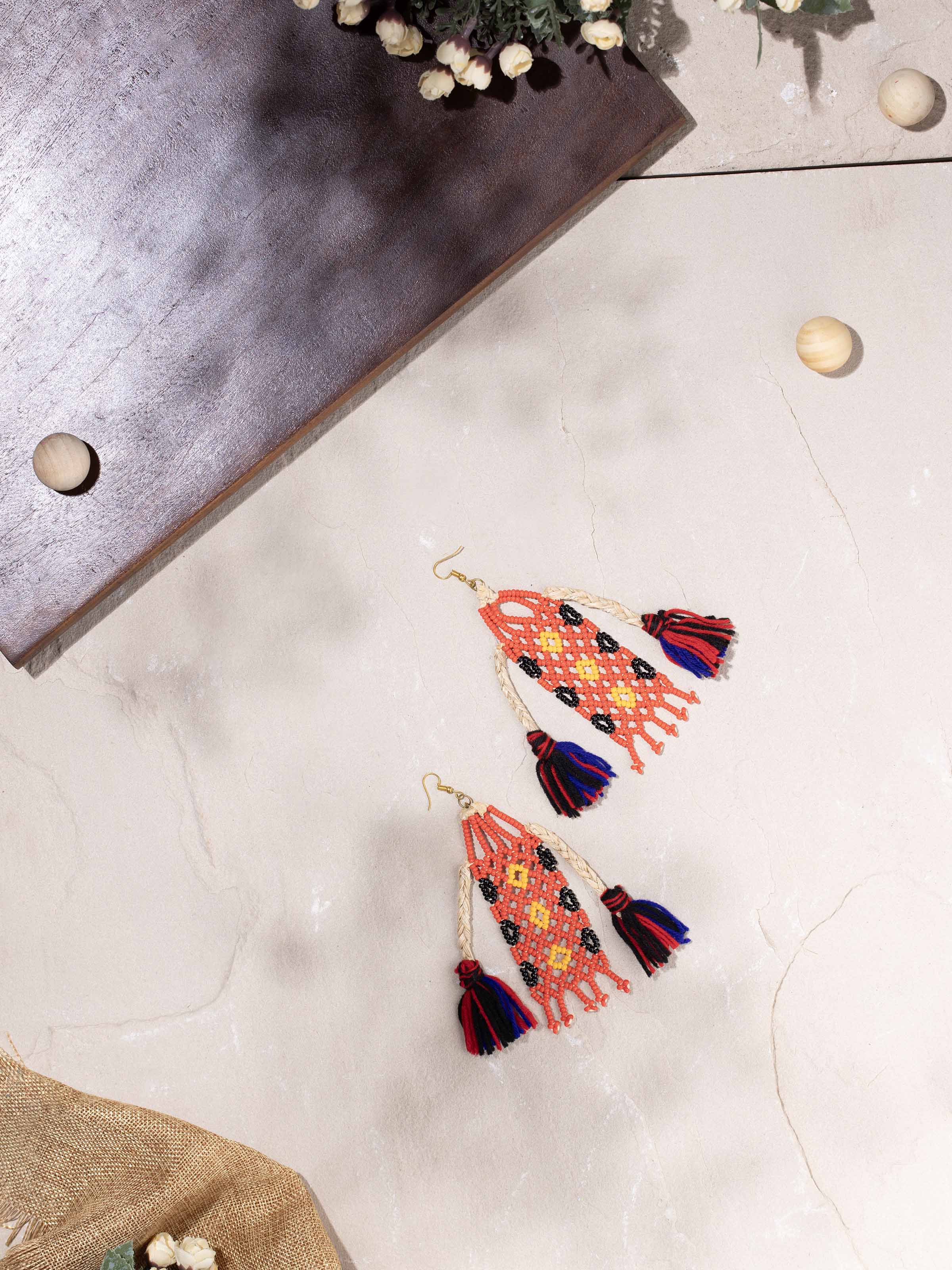 Side view of Bead & Banana Fibre Drop Earrings showcasing their handcrafted design and natural materials.