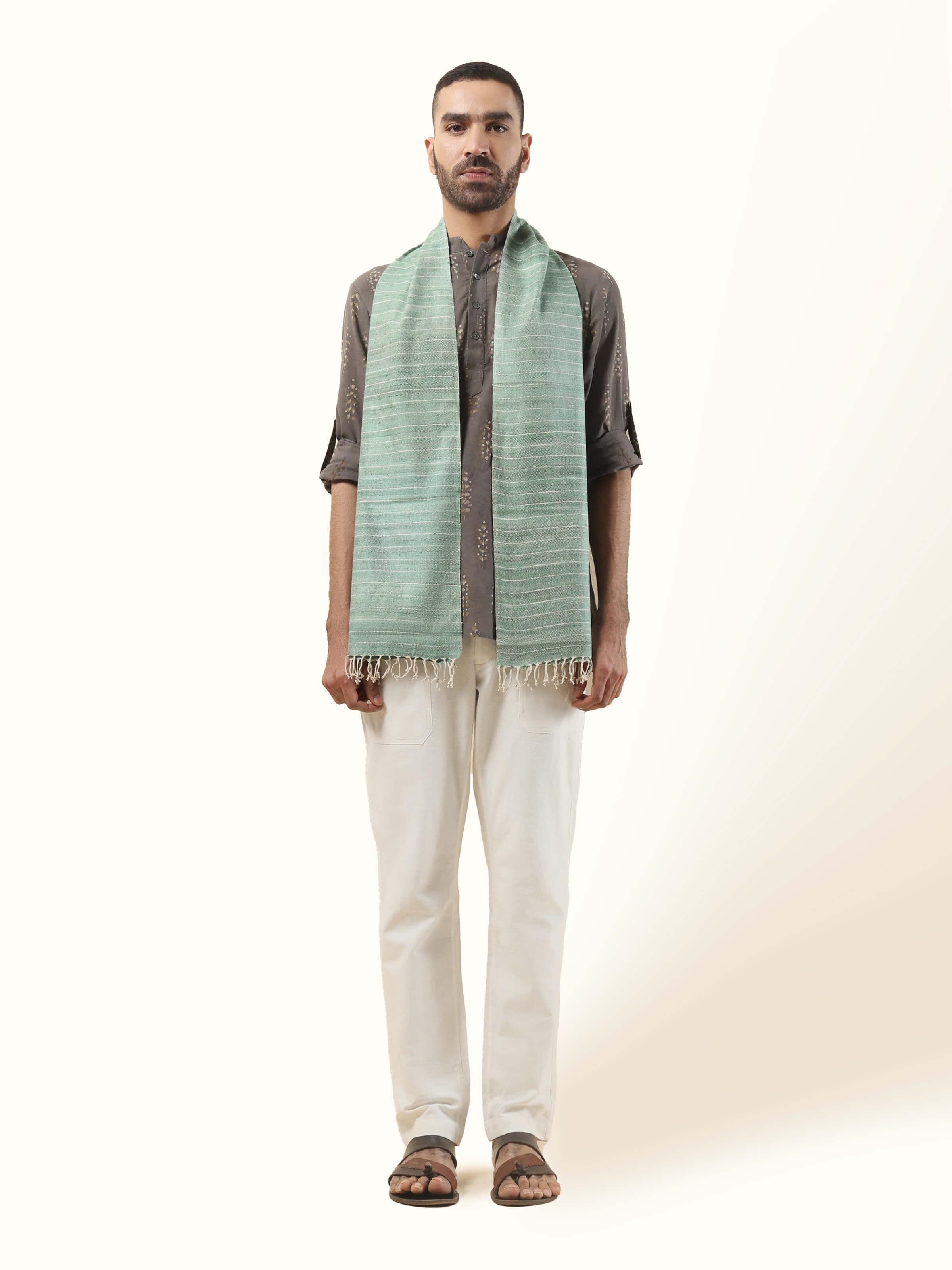 Front view of the light green Eri silk stole, known for its subtle texture and natural sheen.