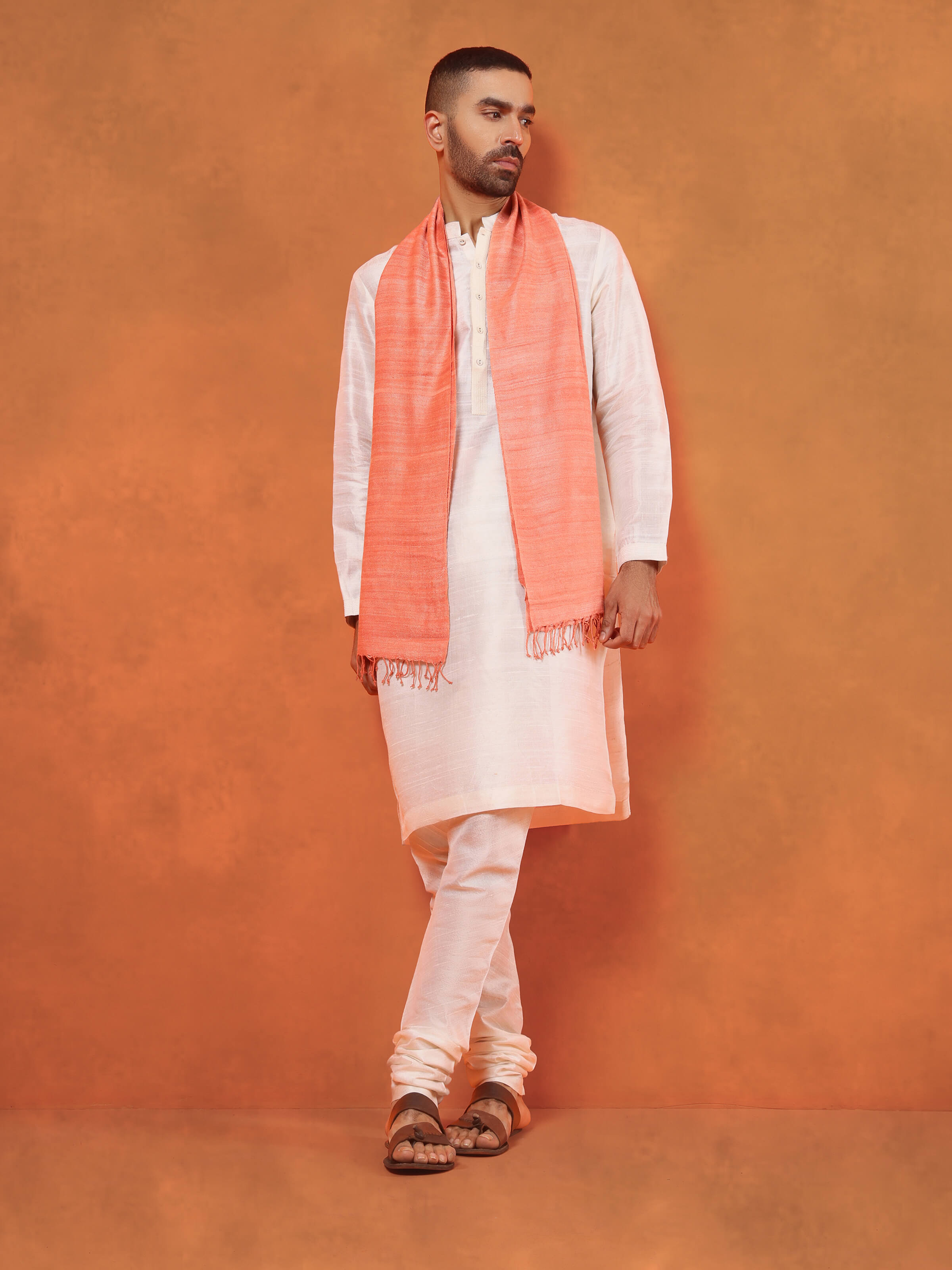 Side view of peach eri silk stole highlighting smooth drape and lightweight feel