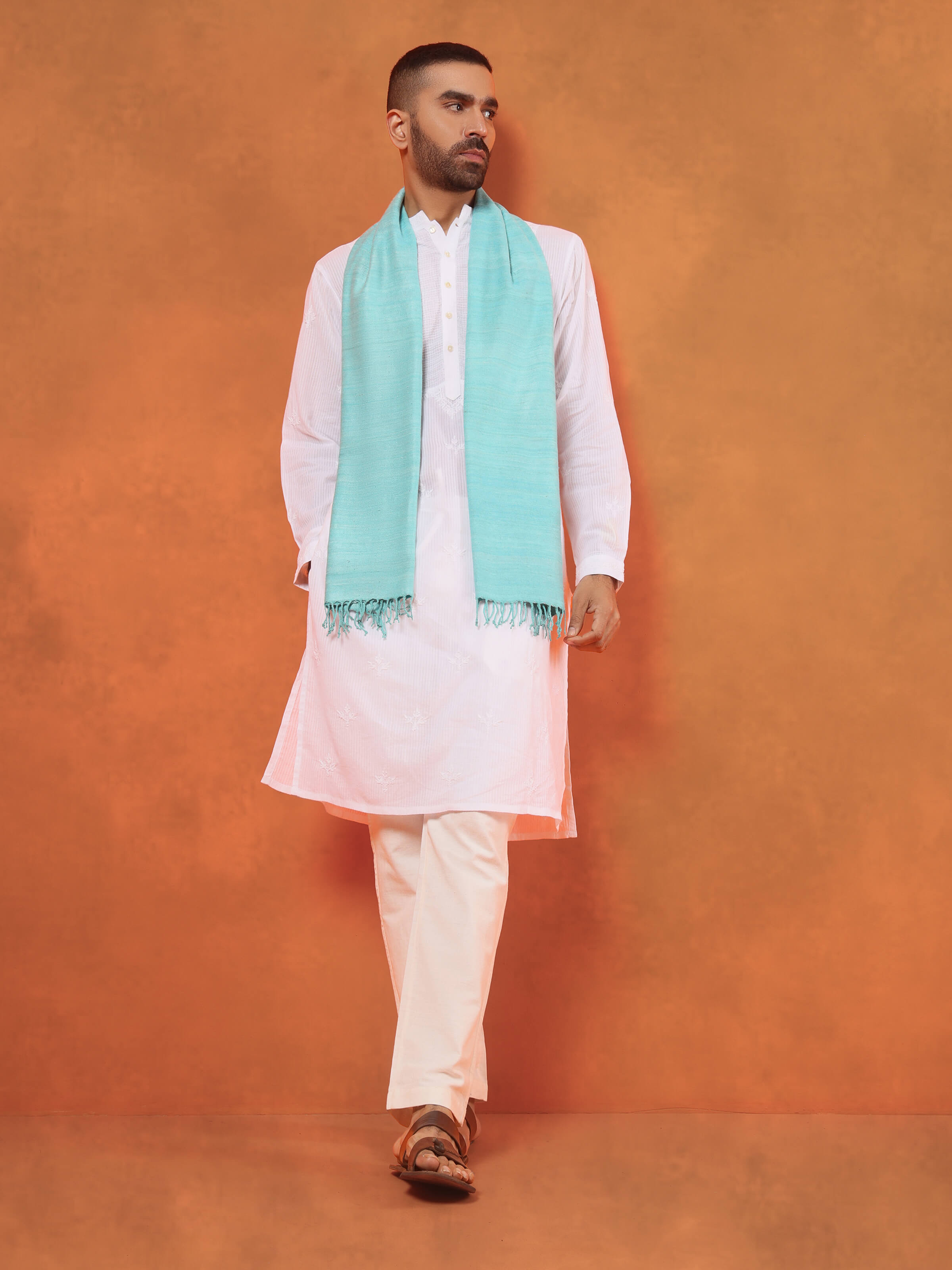 Side view of aqua eri silk stole highlighting lightweight drape and natural flow