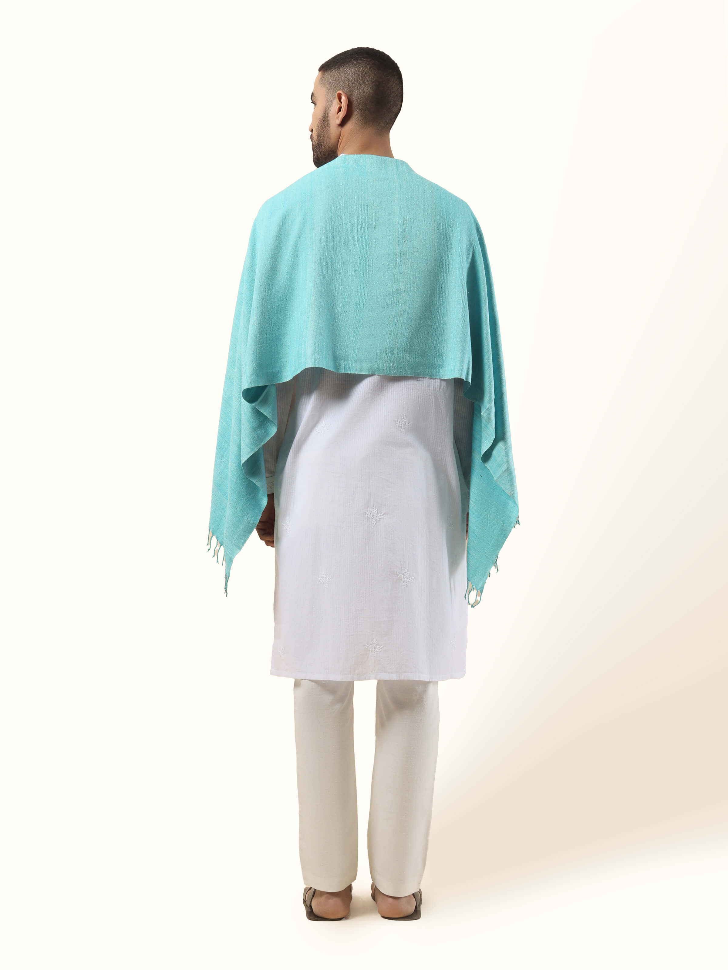 Back view of aqua eri silk stole displaying full length and finishing