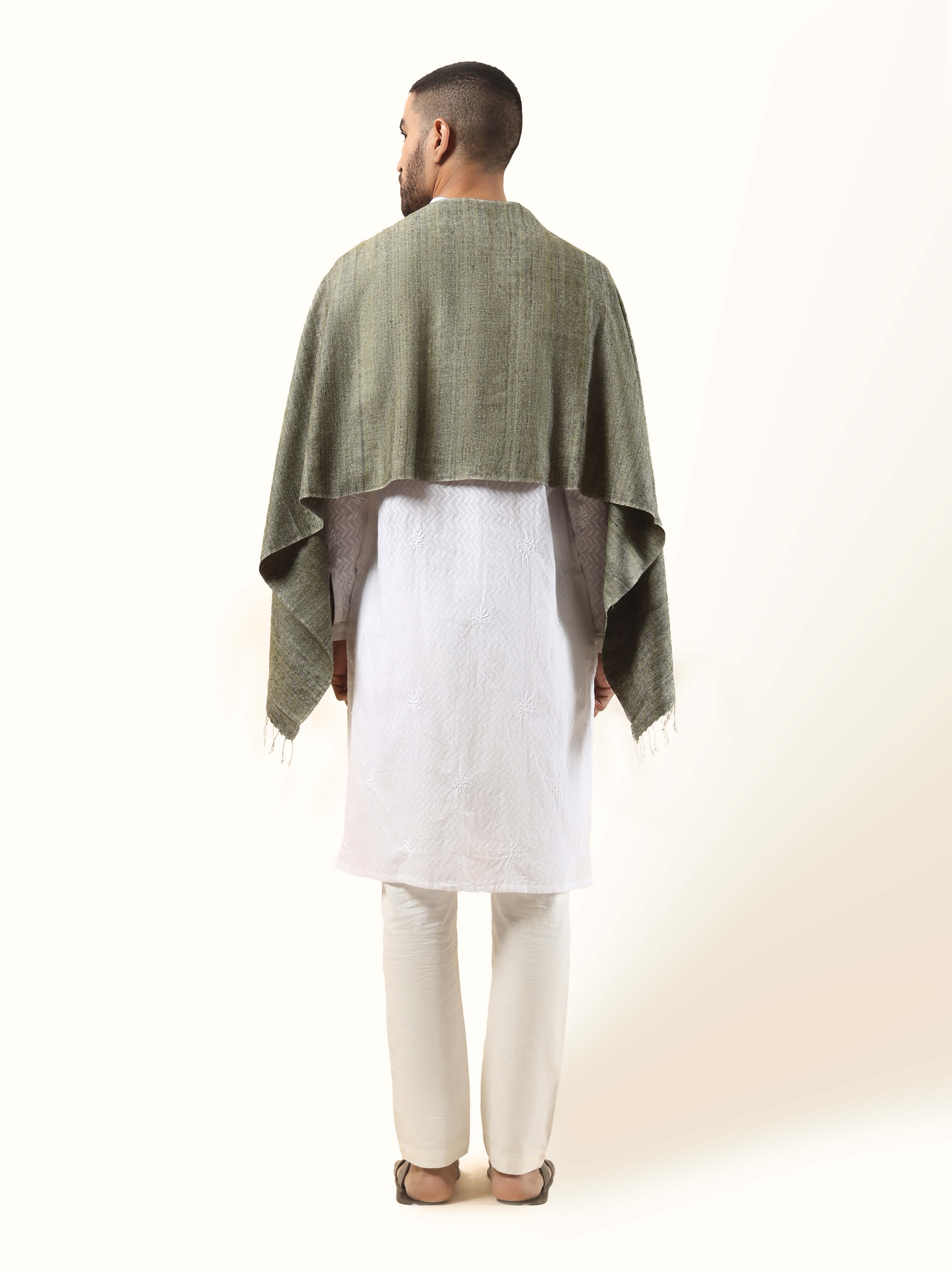 Back view of green Eri silk stole displaying length and subtle woven detail
