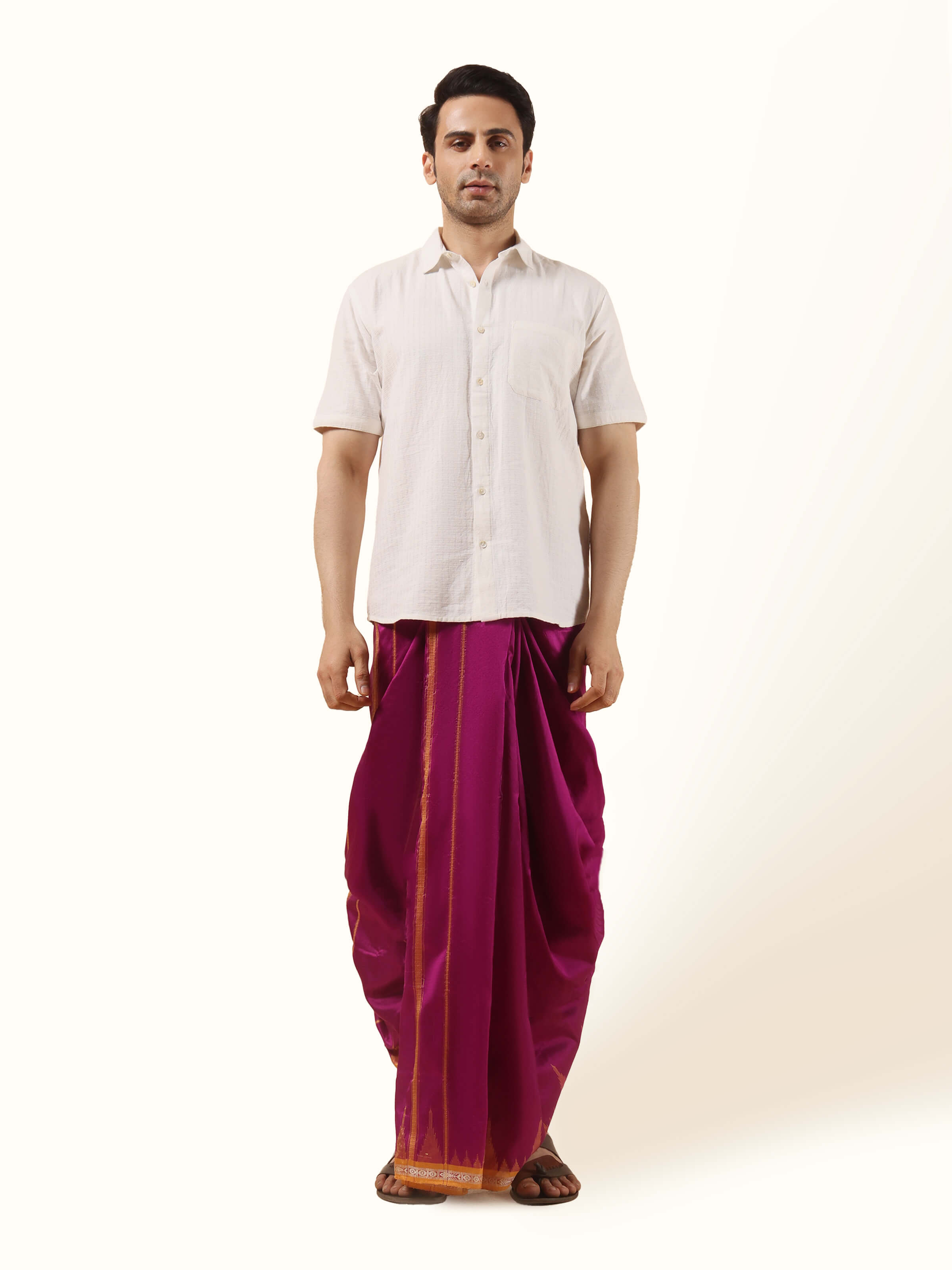 Purple mulberry silk unstitched dhoti fabric folded neatly to show rich texture and vibrant color.