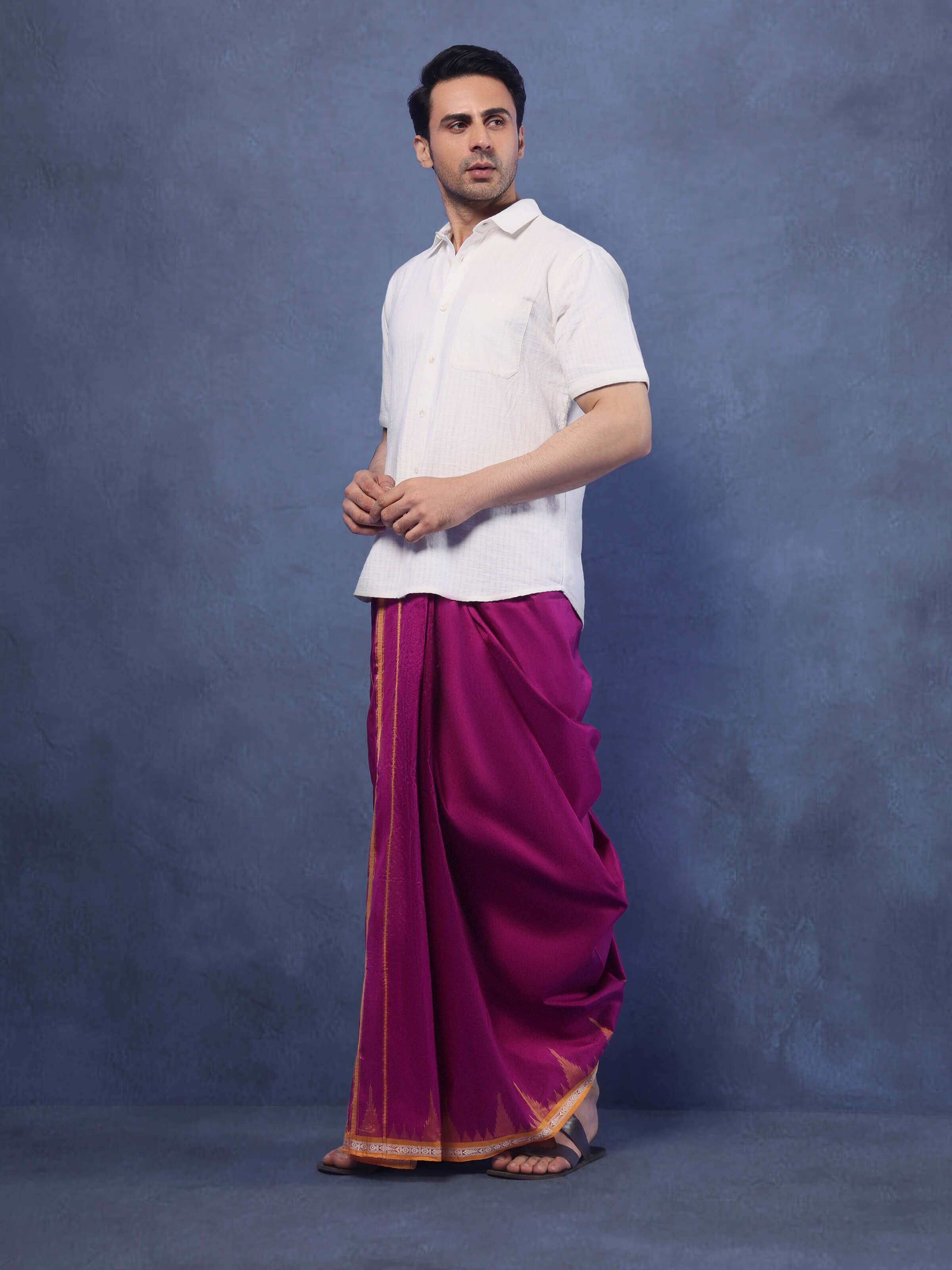 Close-up view of purple mulberry silk dhoti fabric highlighting smooth silk texture and subtle sheen.