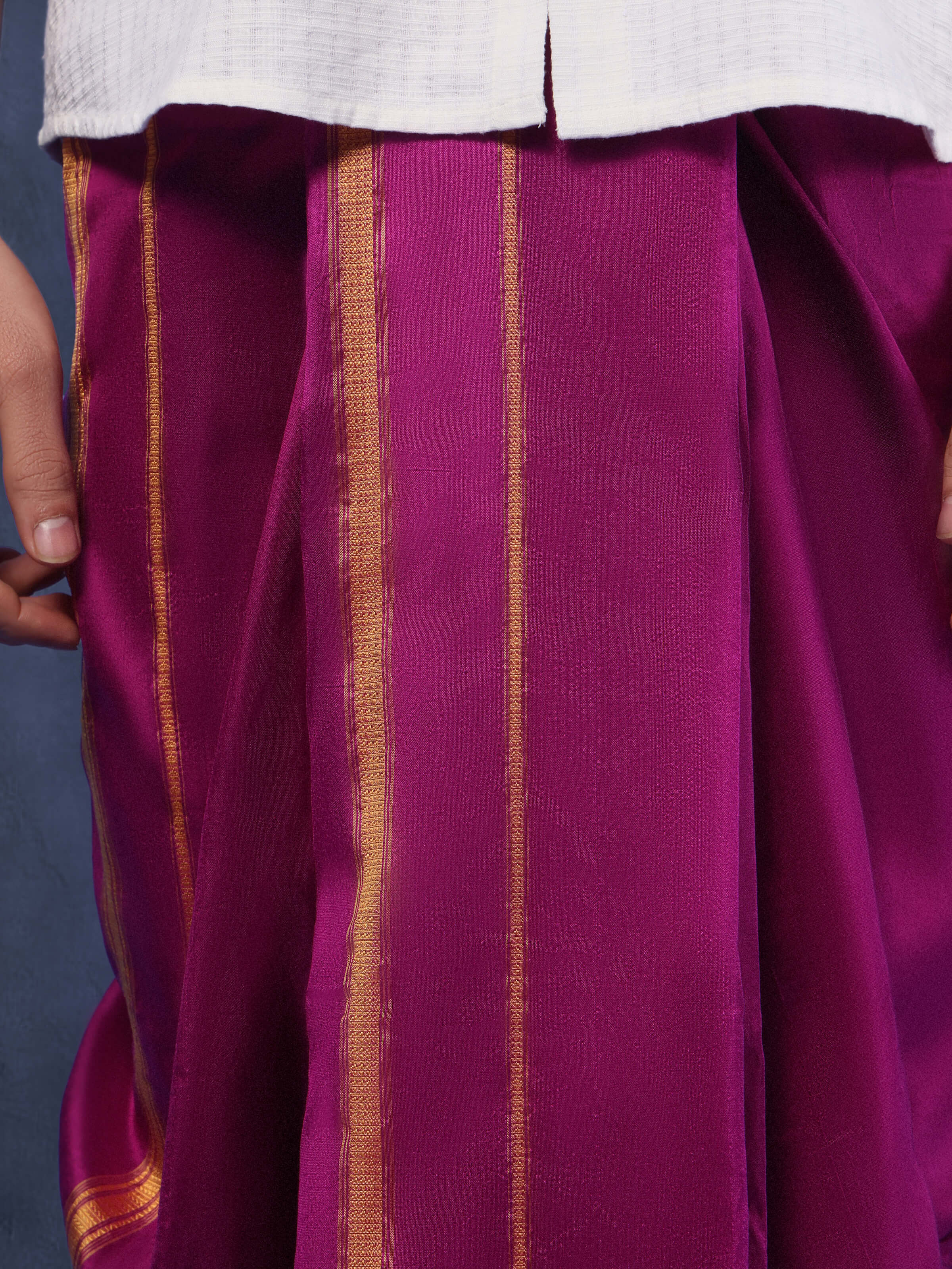 Detailed shot of purple mulberry silk fabric with visible silk weave and natural shine.