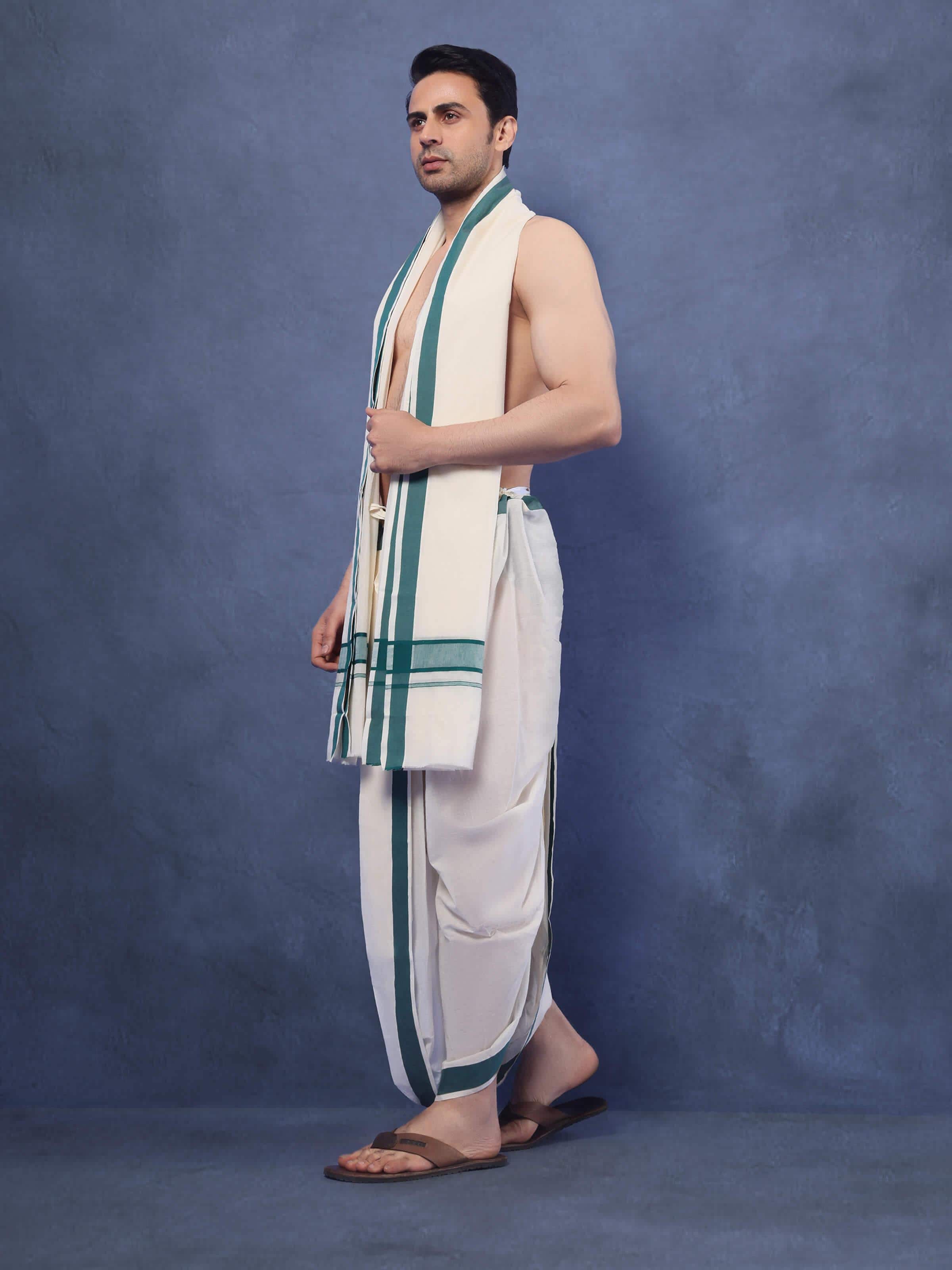 Lifestyle view of green cotton angavastram set styled with kurta for a complete traditional ensemble