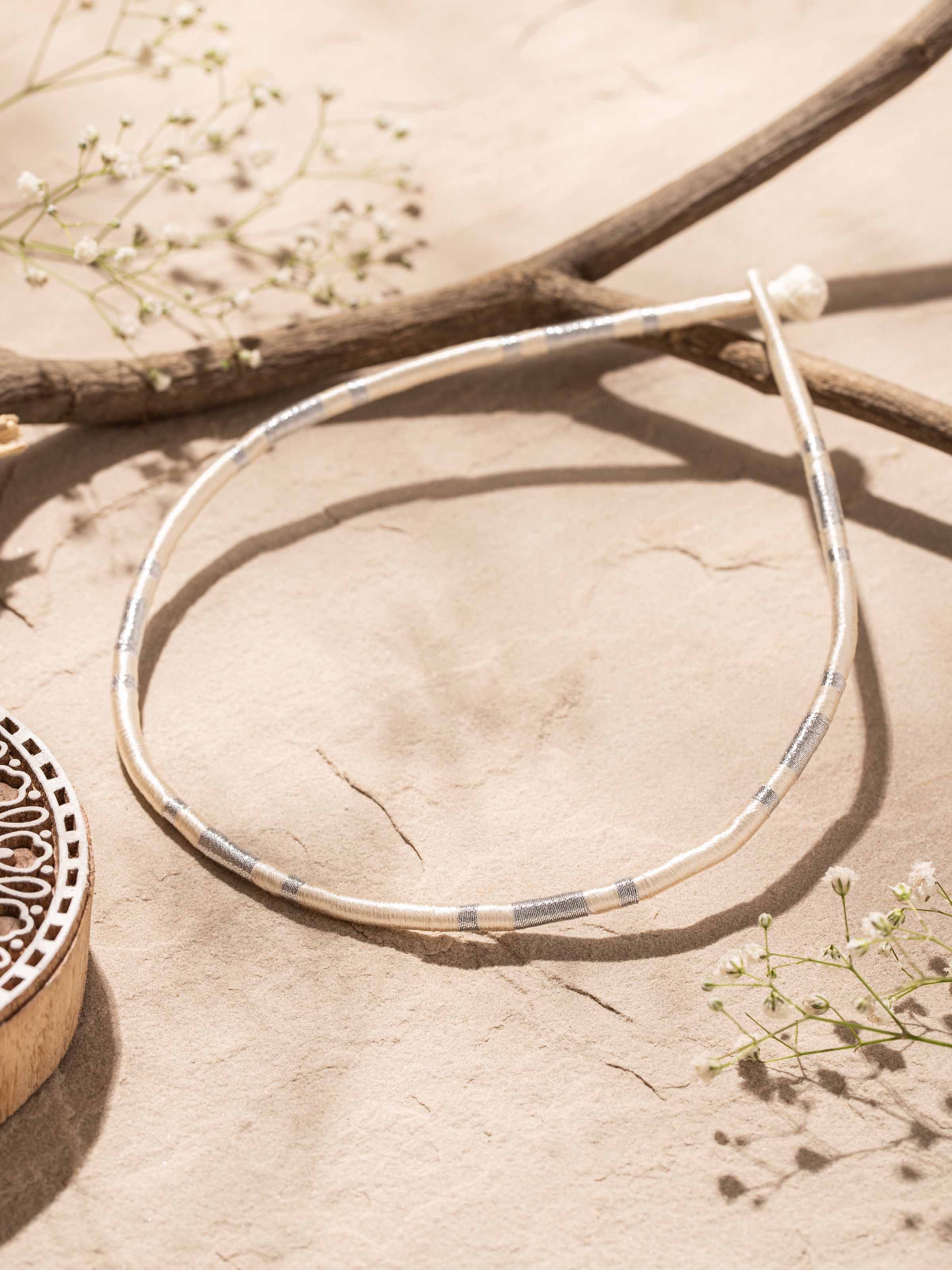 Side view of Patwa collar necklace highlighting the detailed beadwork and traditional patterns