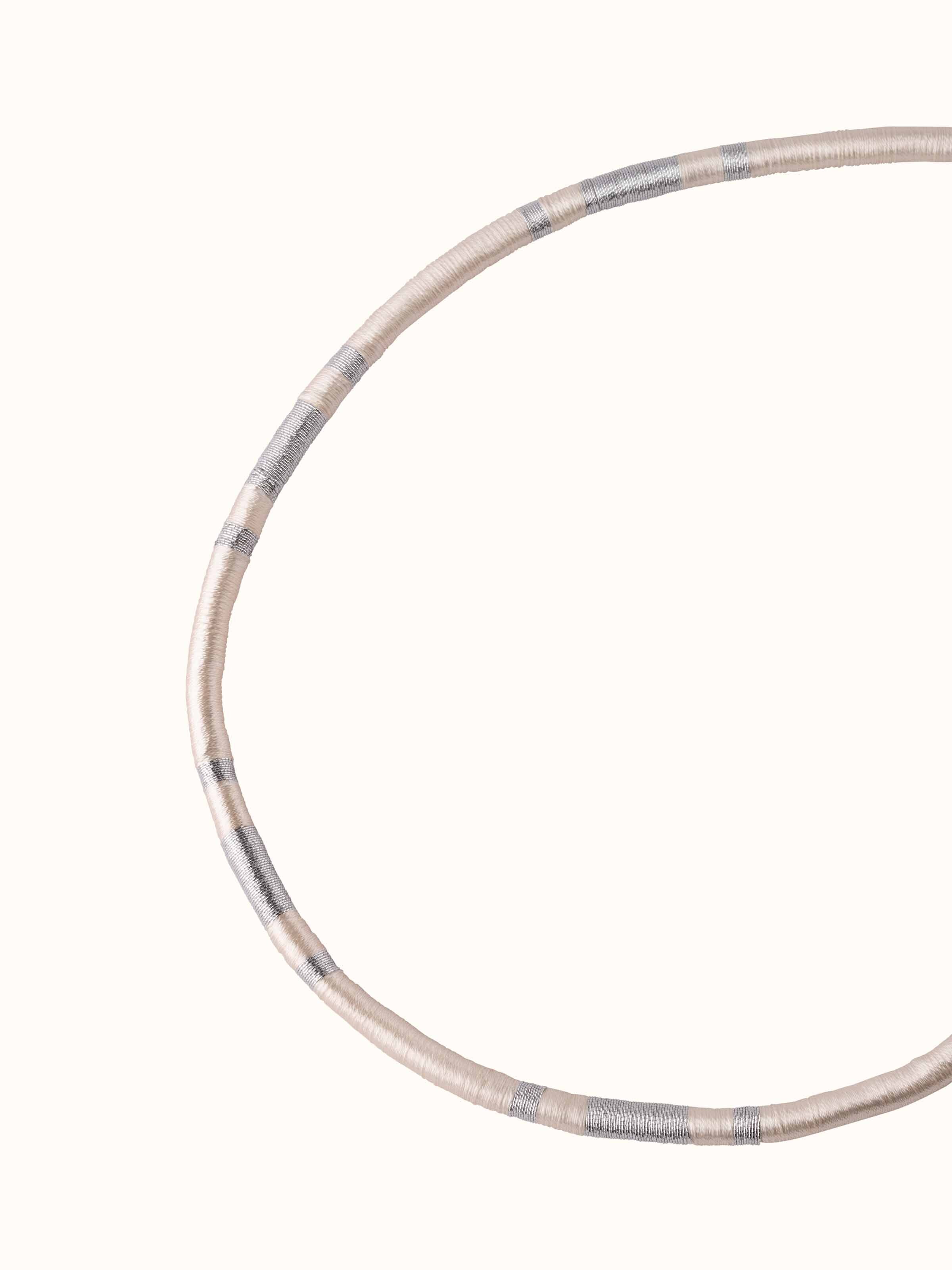 Angled view of Patwa collar necklace showcasing its unique shape and intricate design details