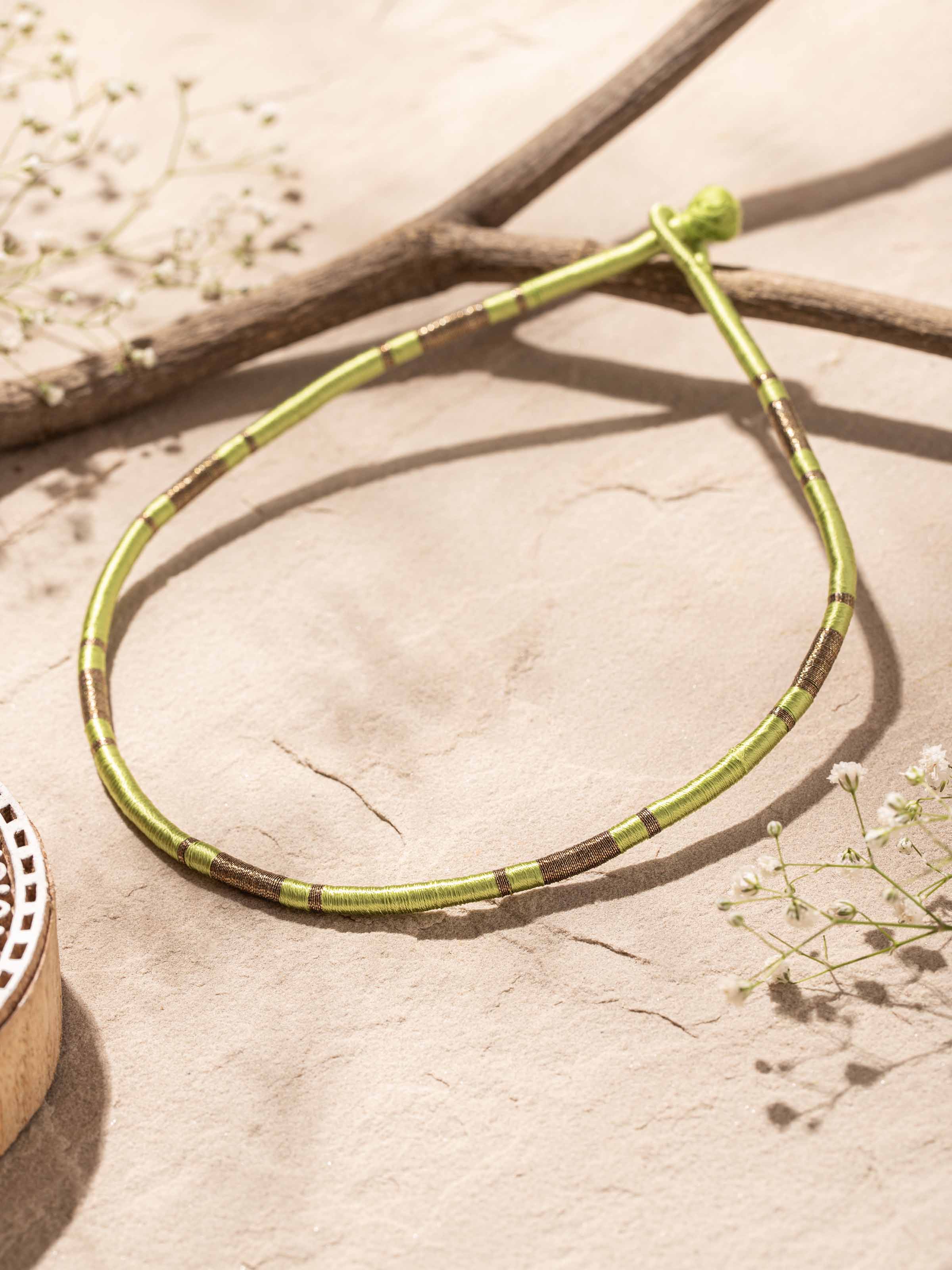 Close-up of Patwa Collar Necklace featuring detailed craftsmanship and ornate decorations.