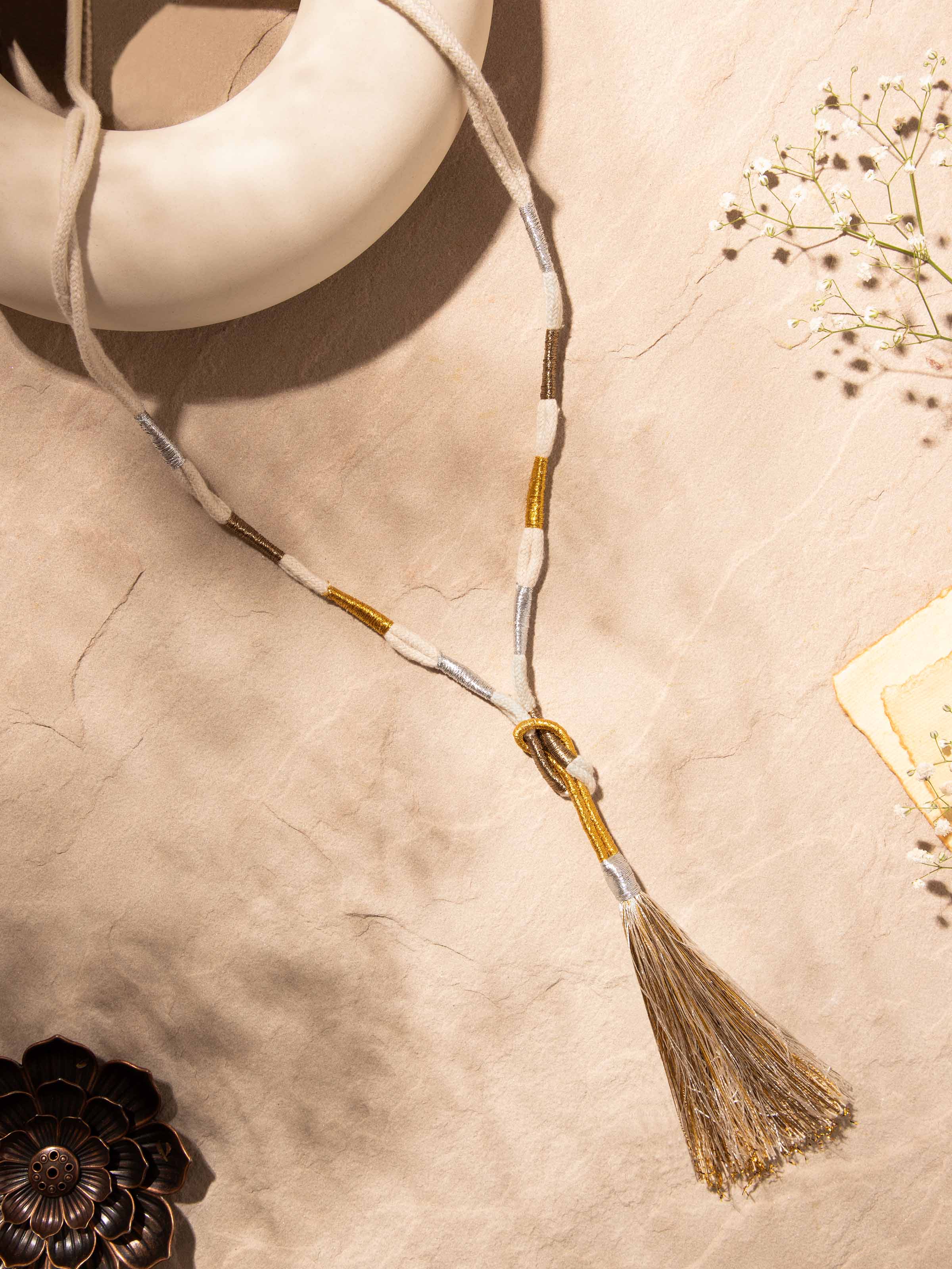 Side view of Patwa long necklace highlighting its detailed embroidery and traditional patterns