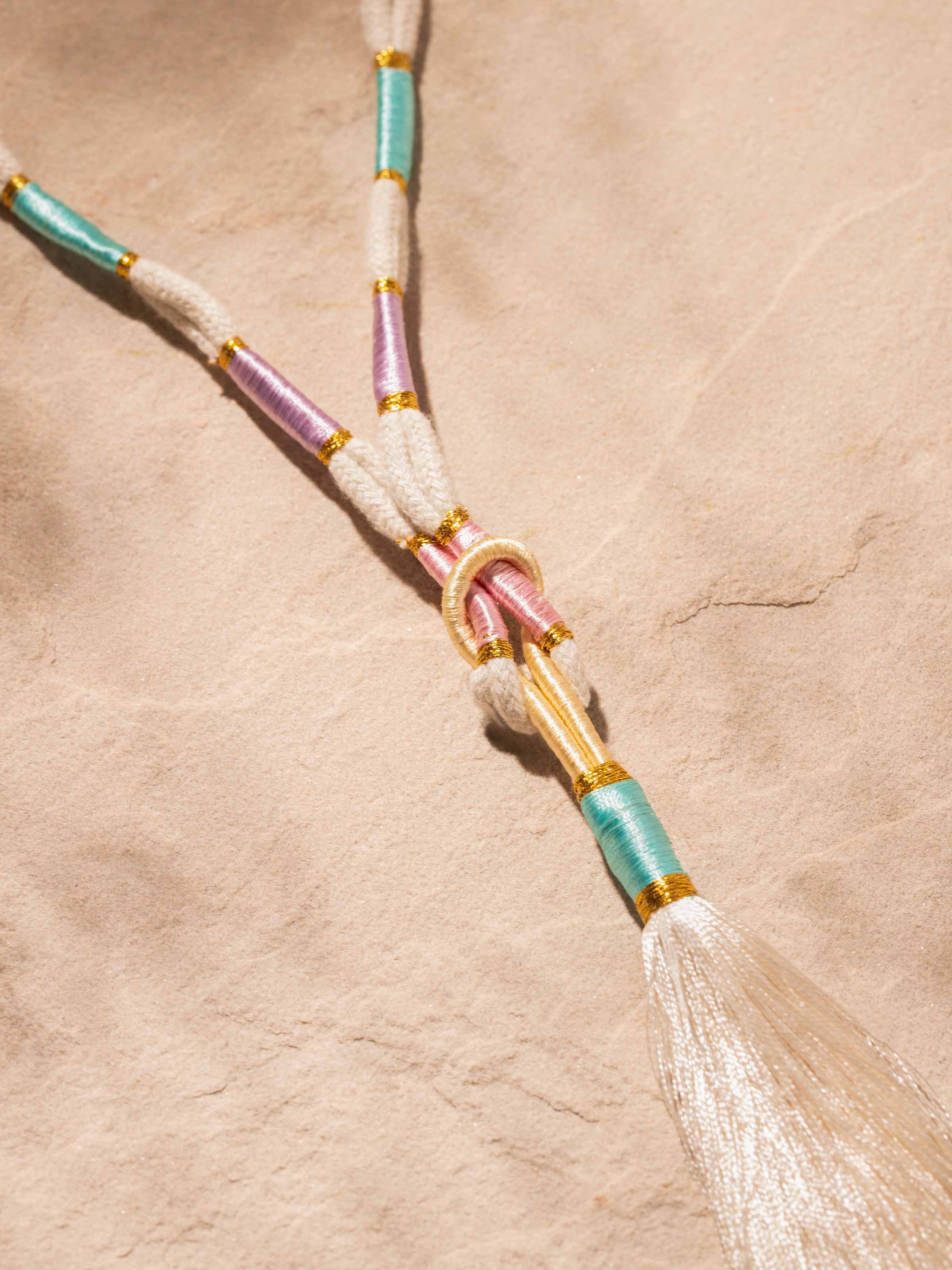 Detailed front view of Patwa long necklace highlighting its intricate beadwork and vibrant colors