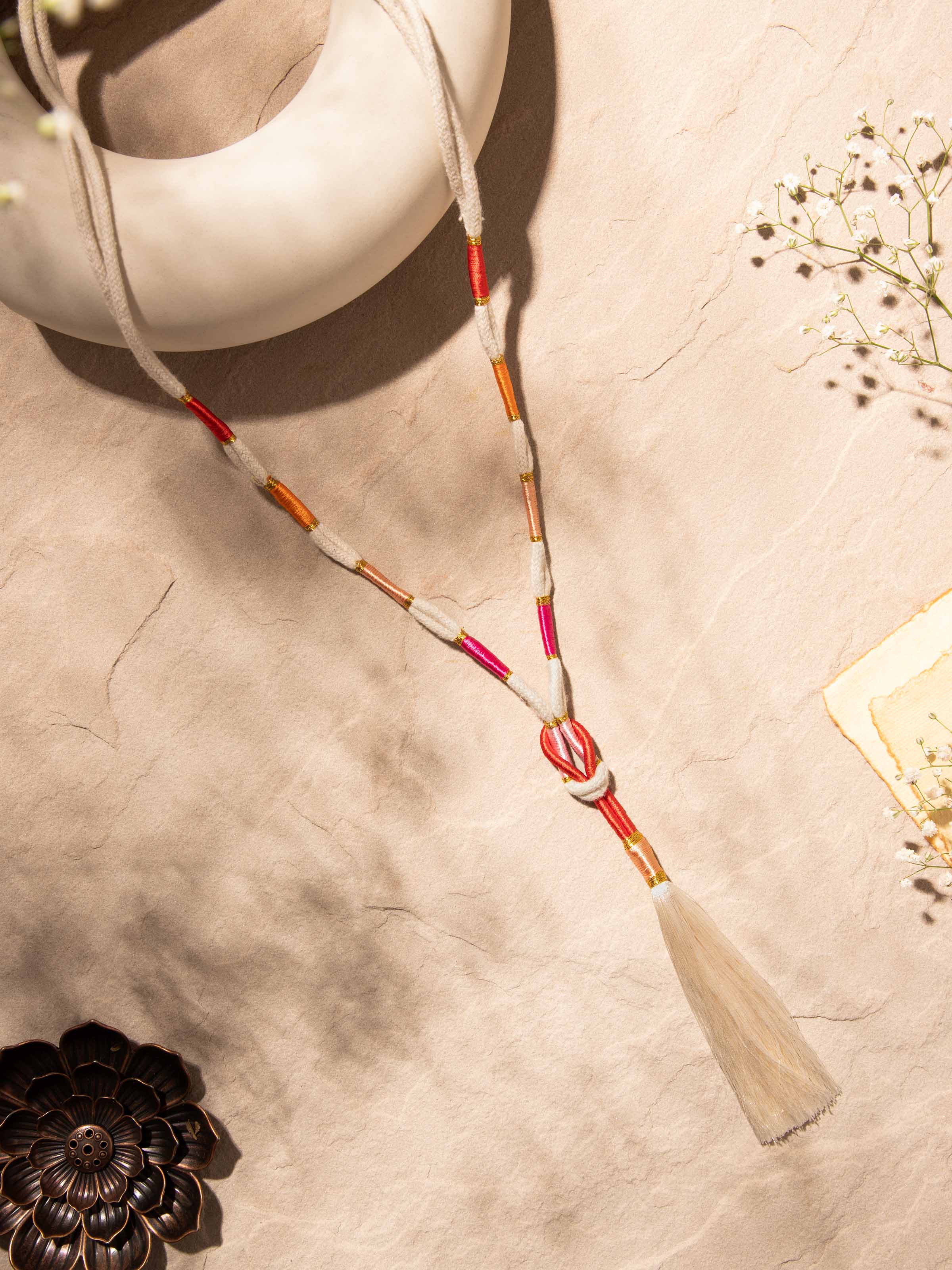 Close-up view of Patwa long necklace emphasizing its elaborate beadwork and texture