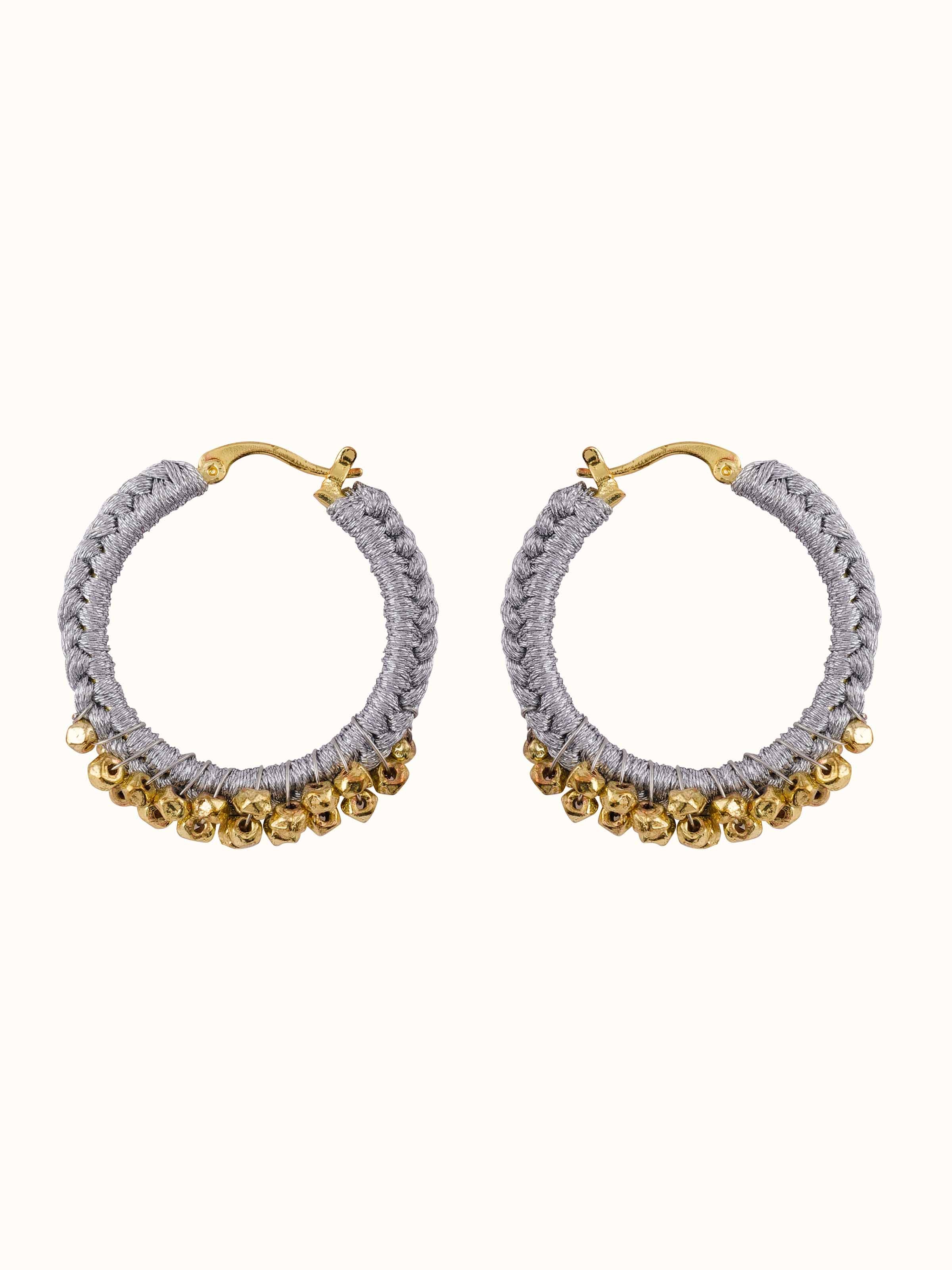 Front view of Zari Patwa hoop earrings showcasing intricate zari work.