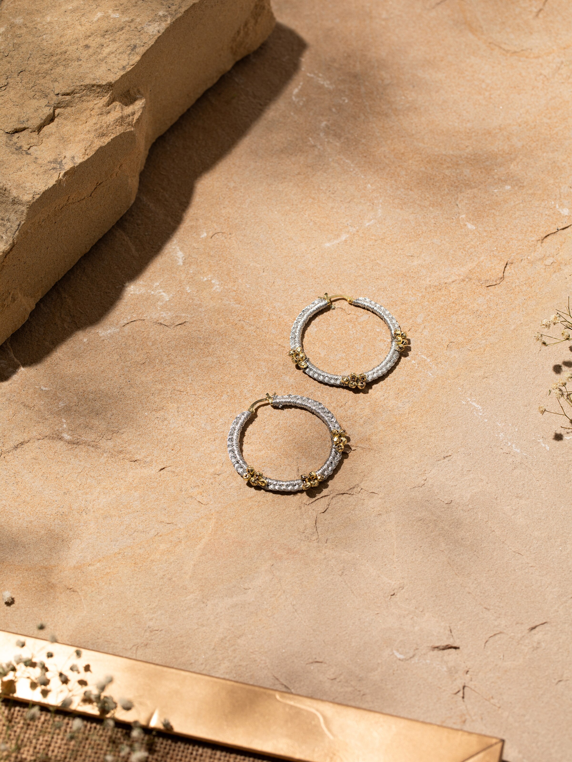 Side view of Zari Patwa hoop earrings highlighting their detailed embroidery and craftsmanship