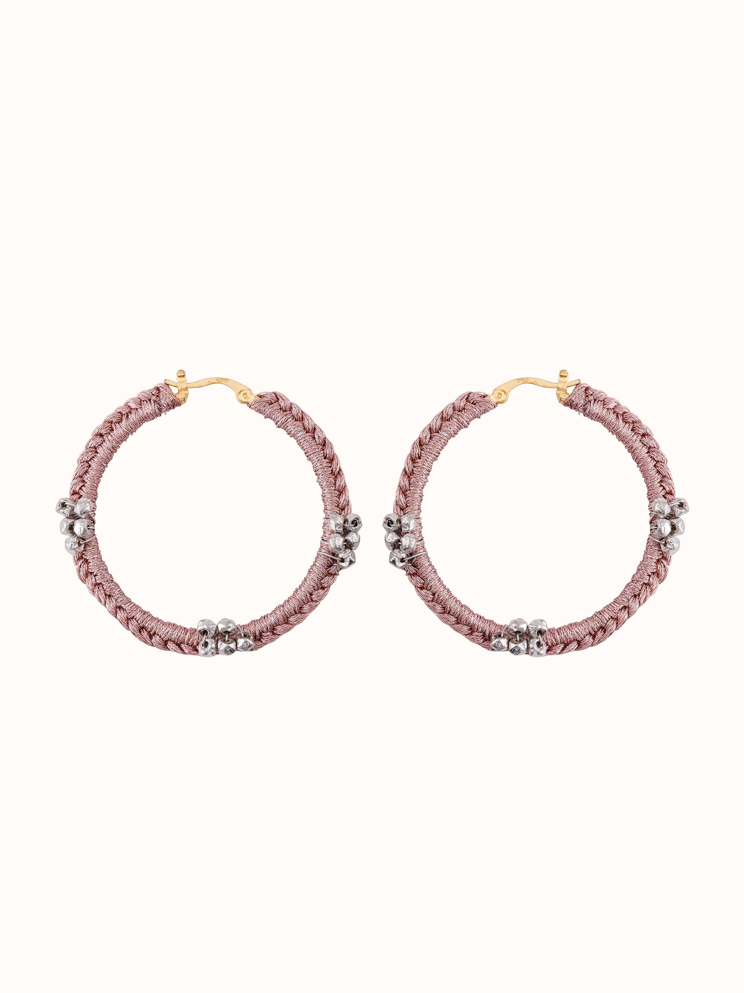 Front view of Zari Patwa hoop earrings with intricate gold thread detailing and polished finish