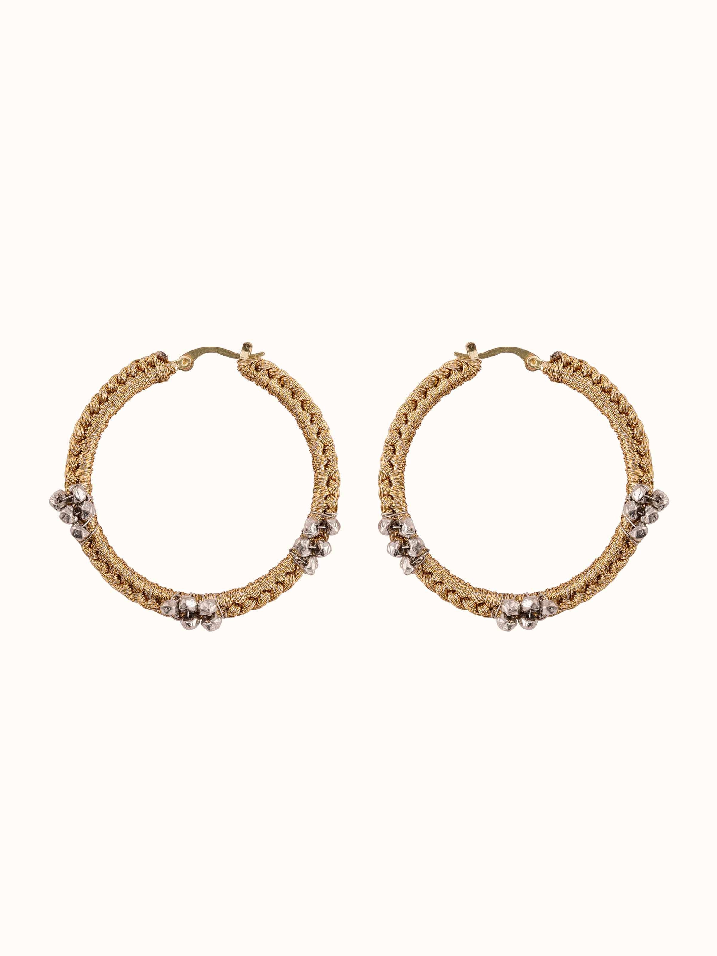 Front view of Zari Patwa hoop earrings showcasing vibrant threadwork and circular silhouette