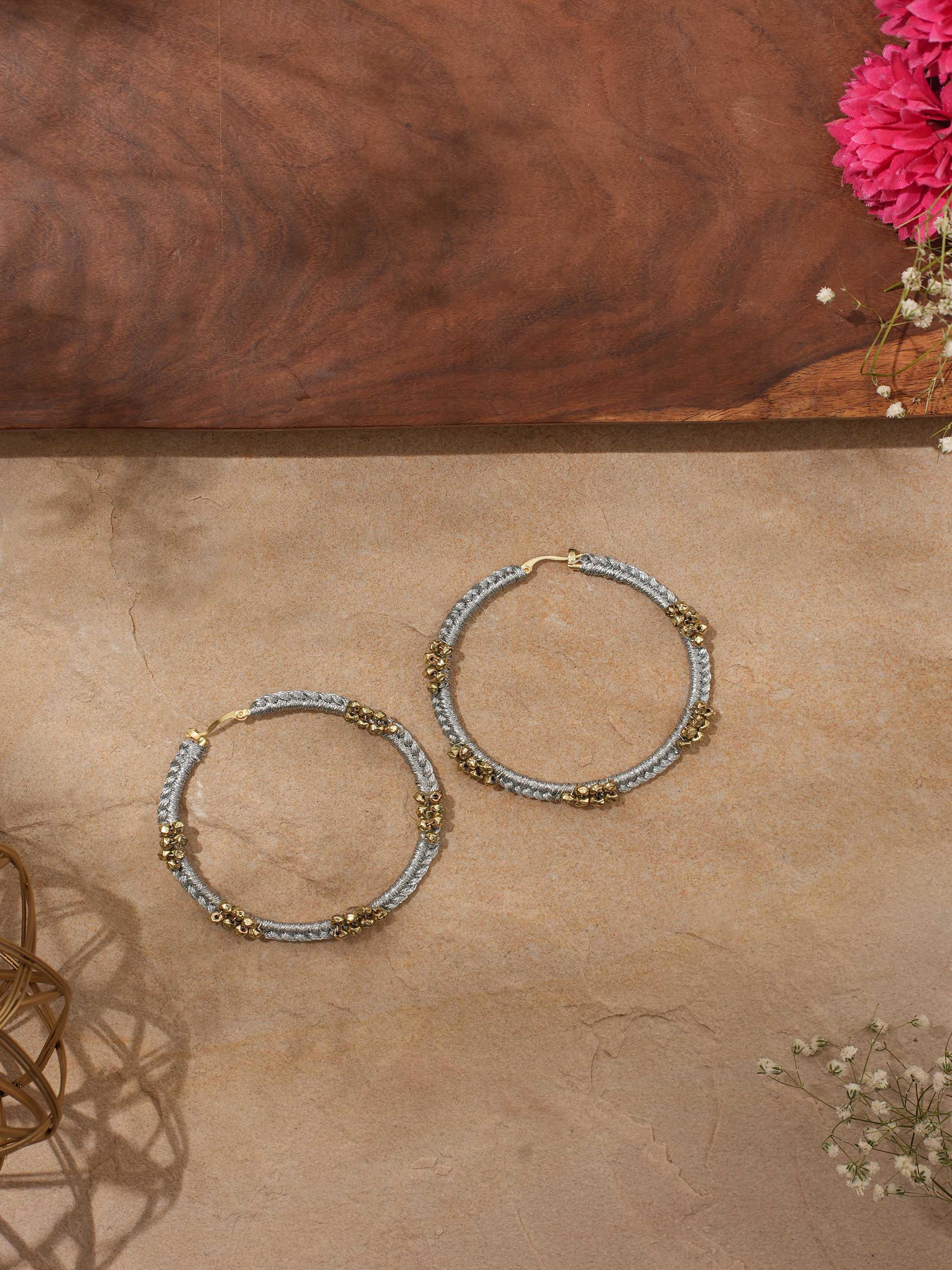Side view of Zari Patwa Hoop Earrings showing the hoop design and embellishments.