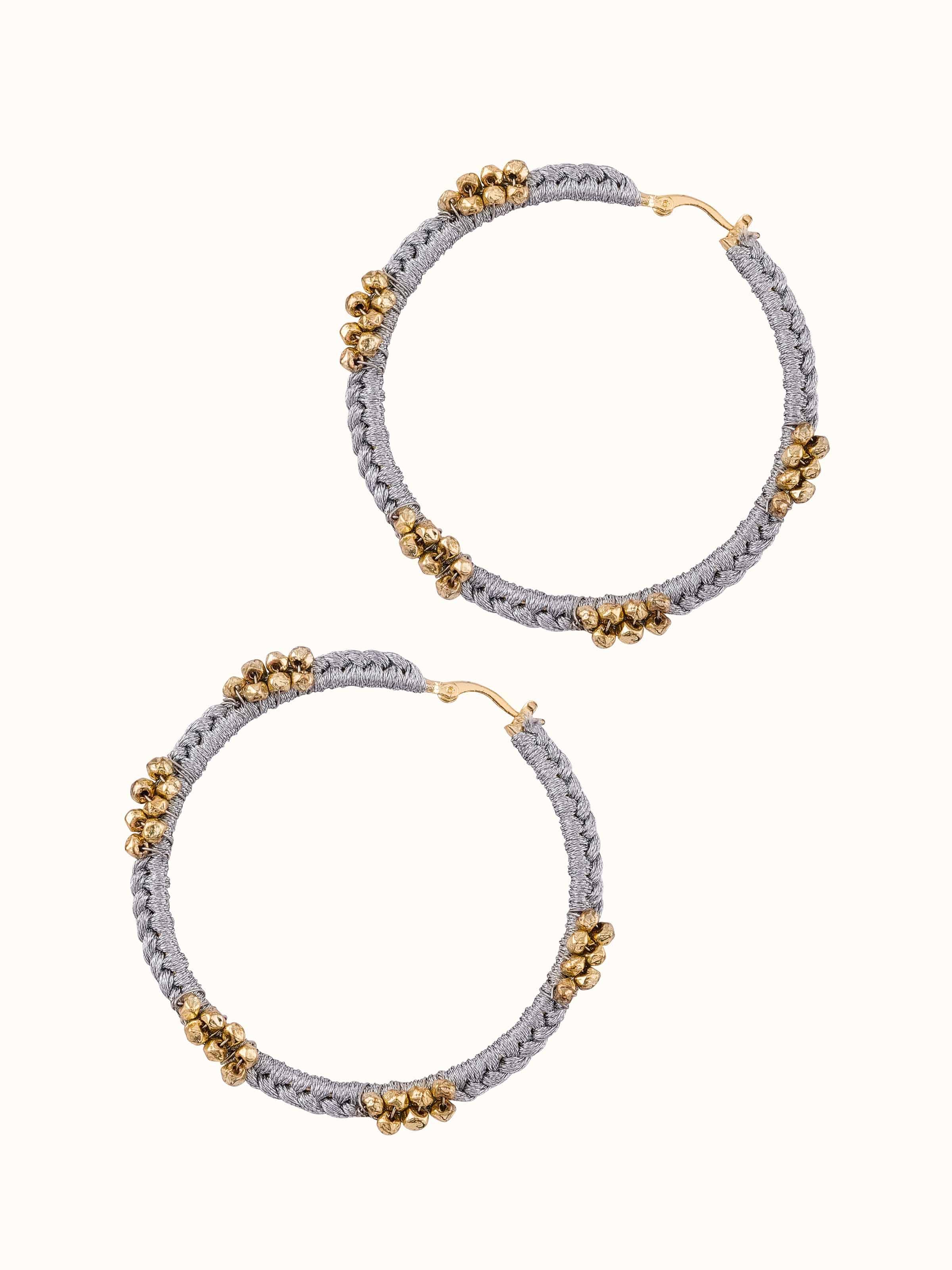 Angled view of Zari Patwa Hoop Earrings emphasizing the rich zari work.