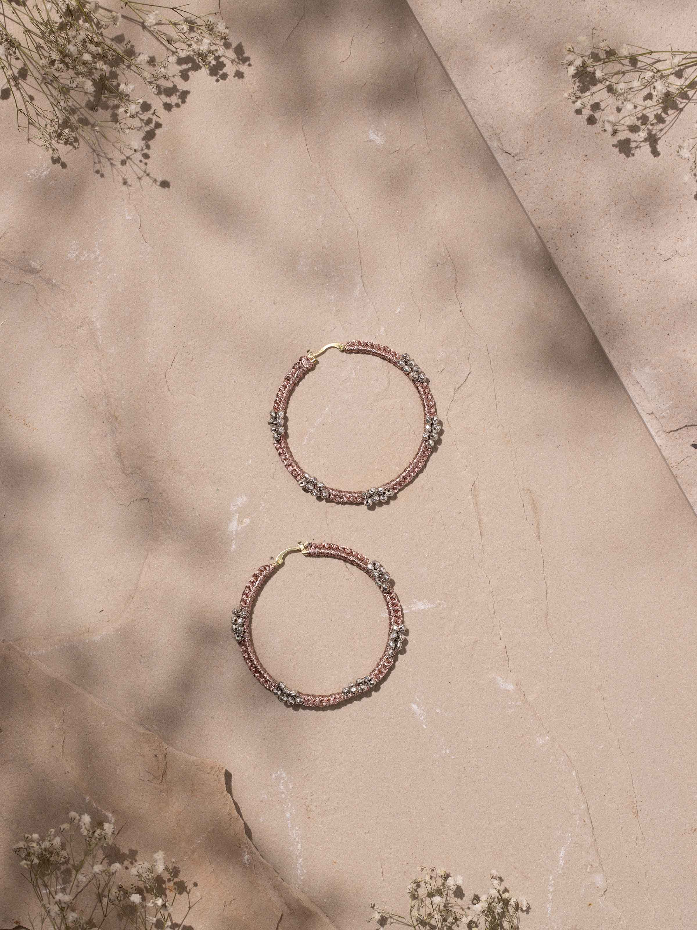 Close-up of Zari Patwa Hoop Earrings showcasing the detailed zari embroidery and hoop structure.