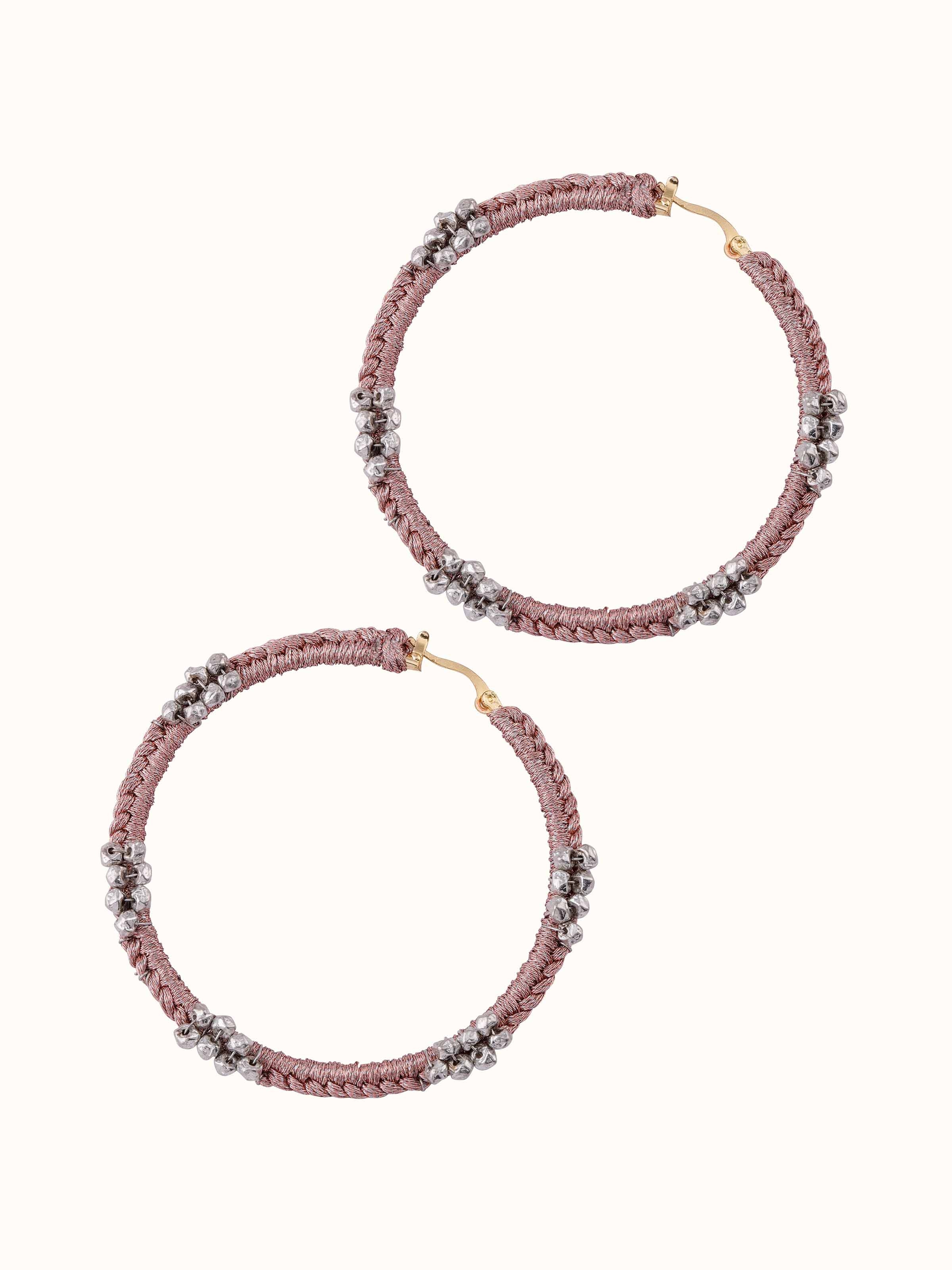 Angled view of Zari Patwa Hoop Earrings showcasing the elegant design and detailed zari work.