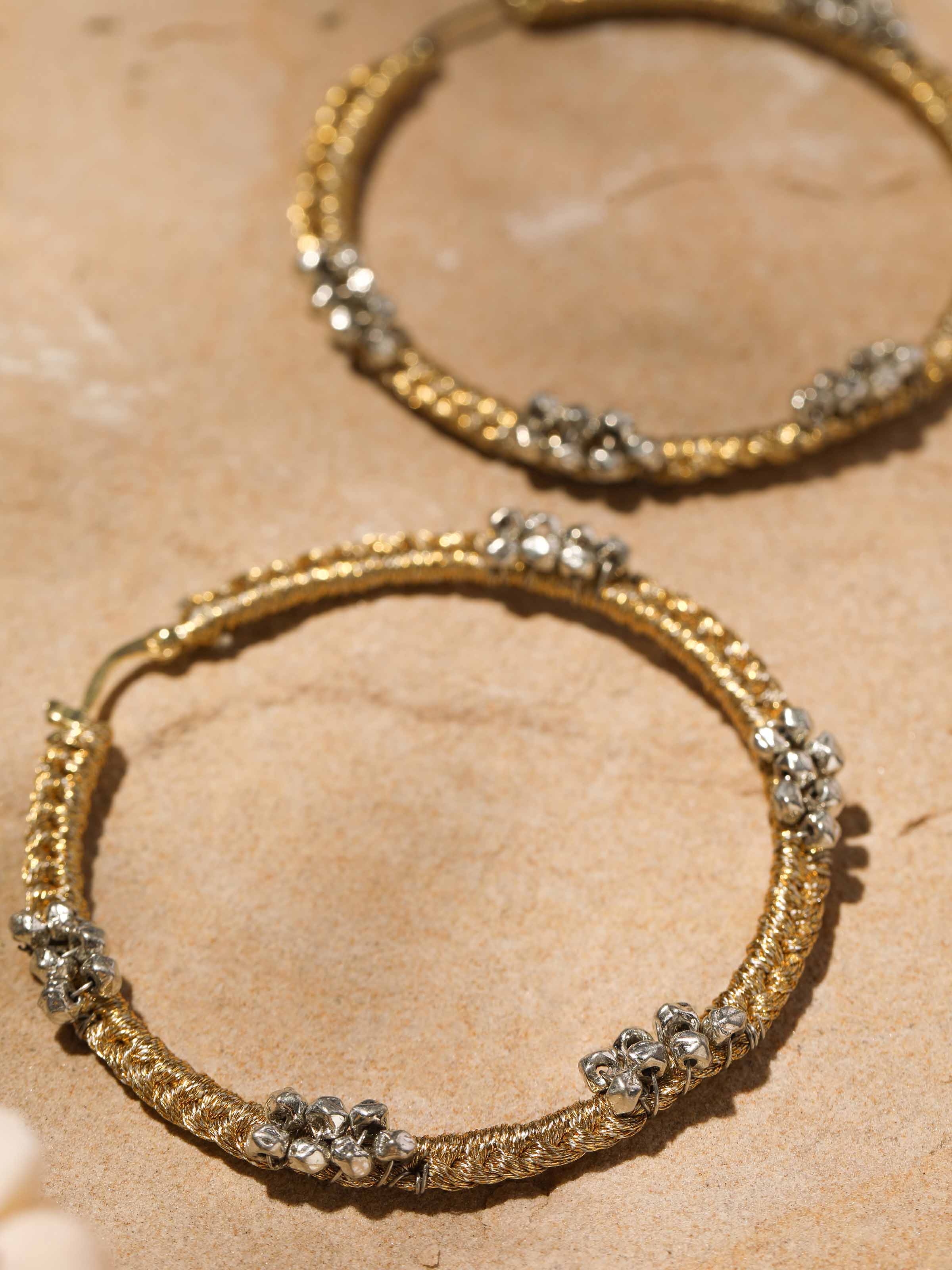 Detailed close-up of Zari Patwa Hoop Earrings featuring traditional design and elegant finish.