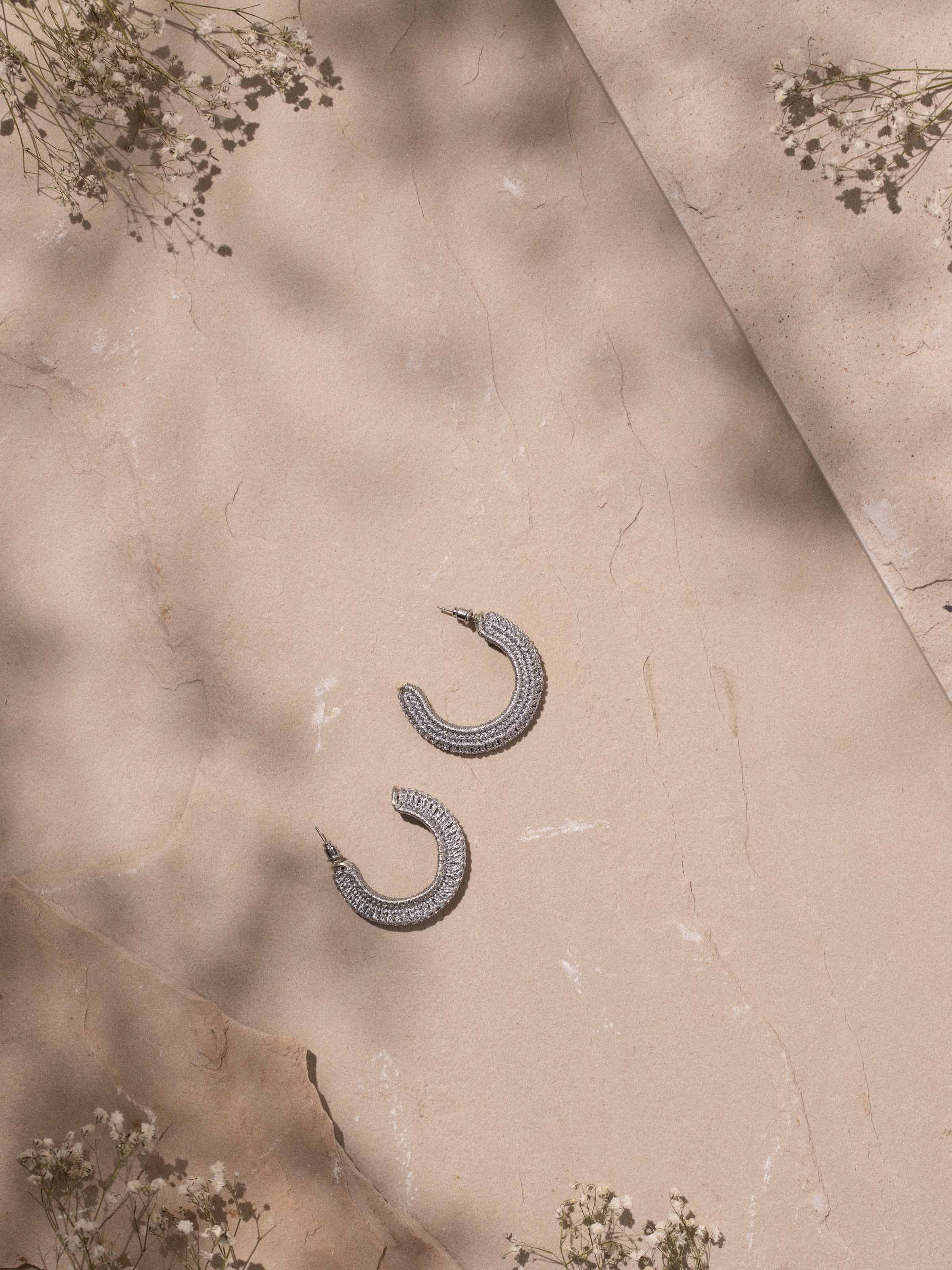 Side view of Zari Patwa hoop earrings emphasizing their elegant hoop design and detailed work.