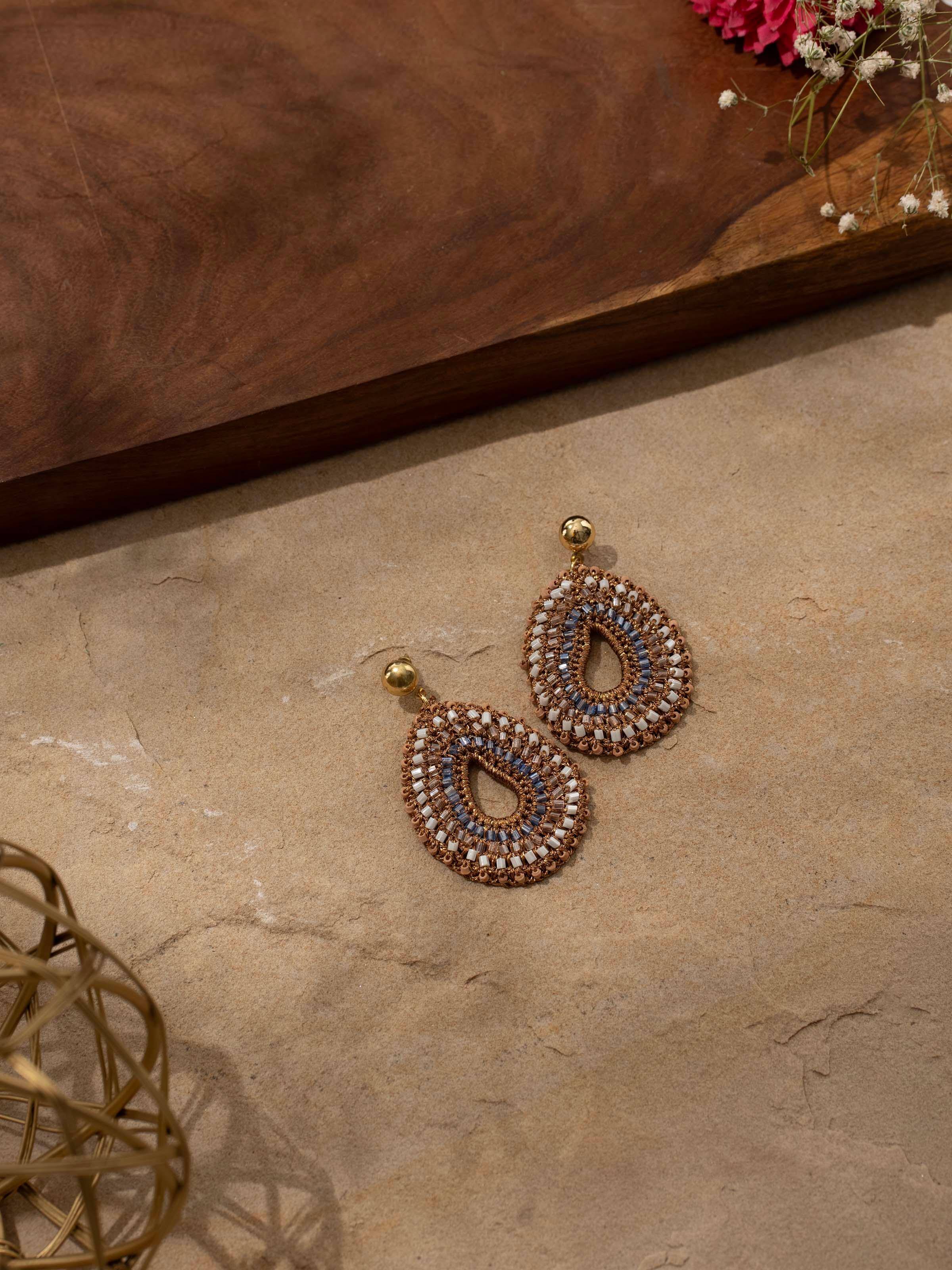 Detailed overhead shot showing texture and vibrant colors of the earrings