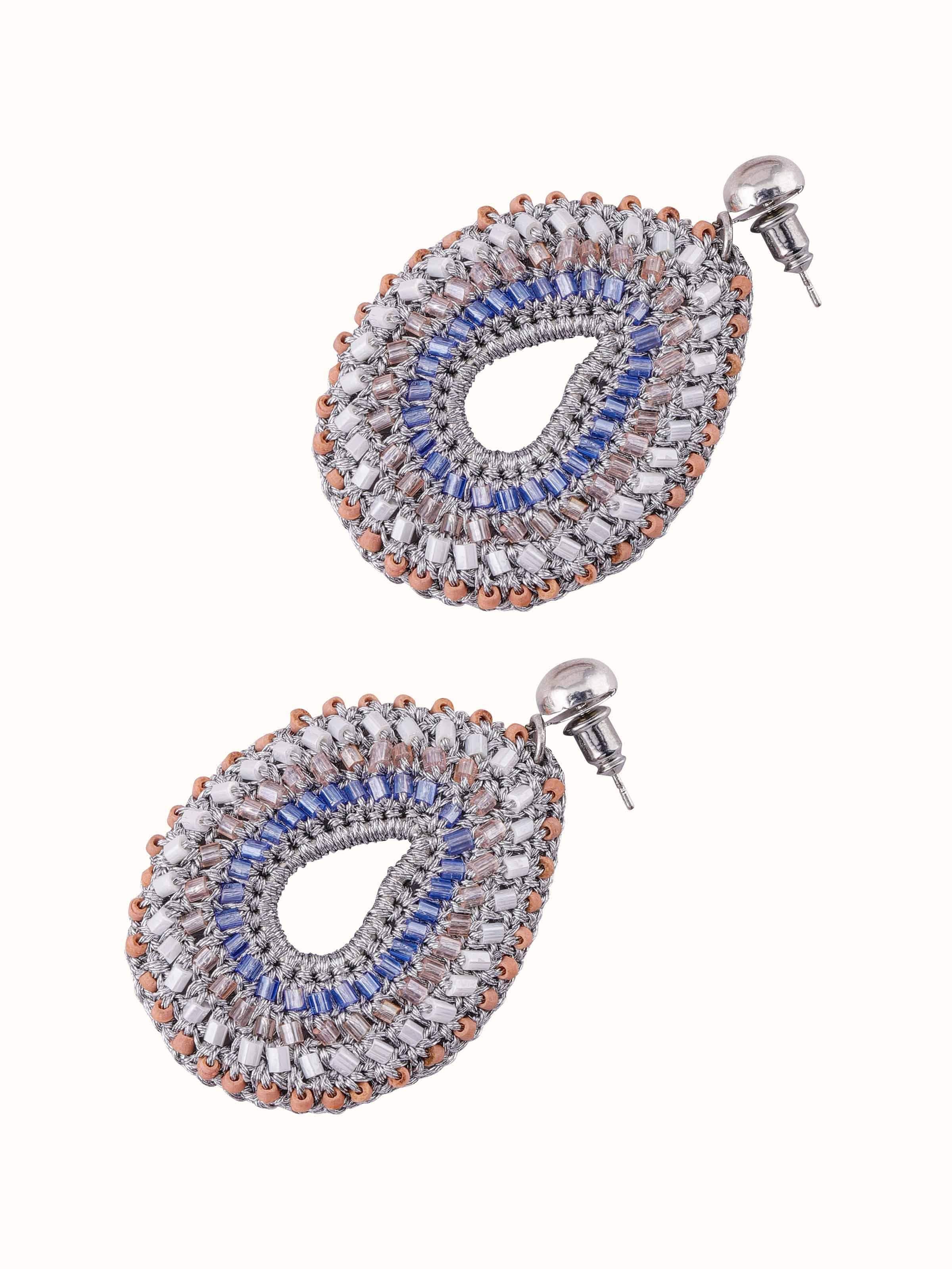 Detailed view of Zari Patwa drop earrings featuring intricate gold threadwork and delicate dangling elements.