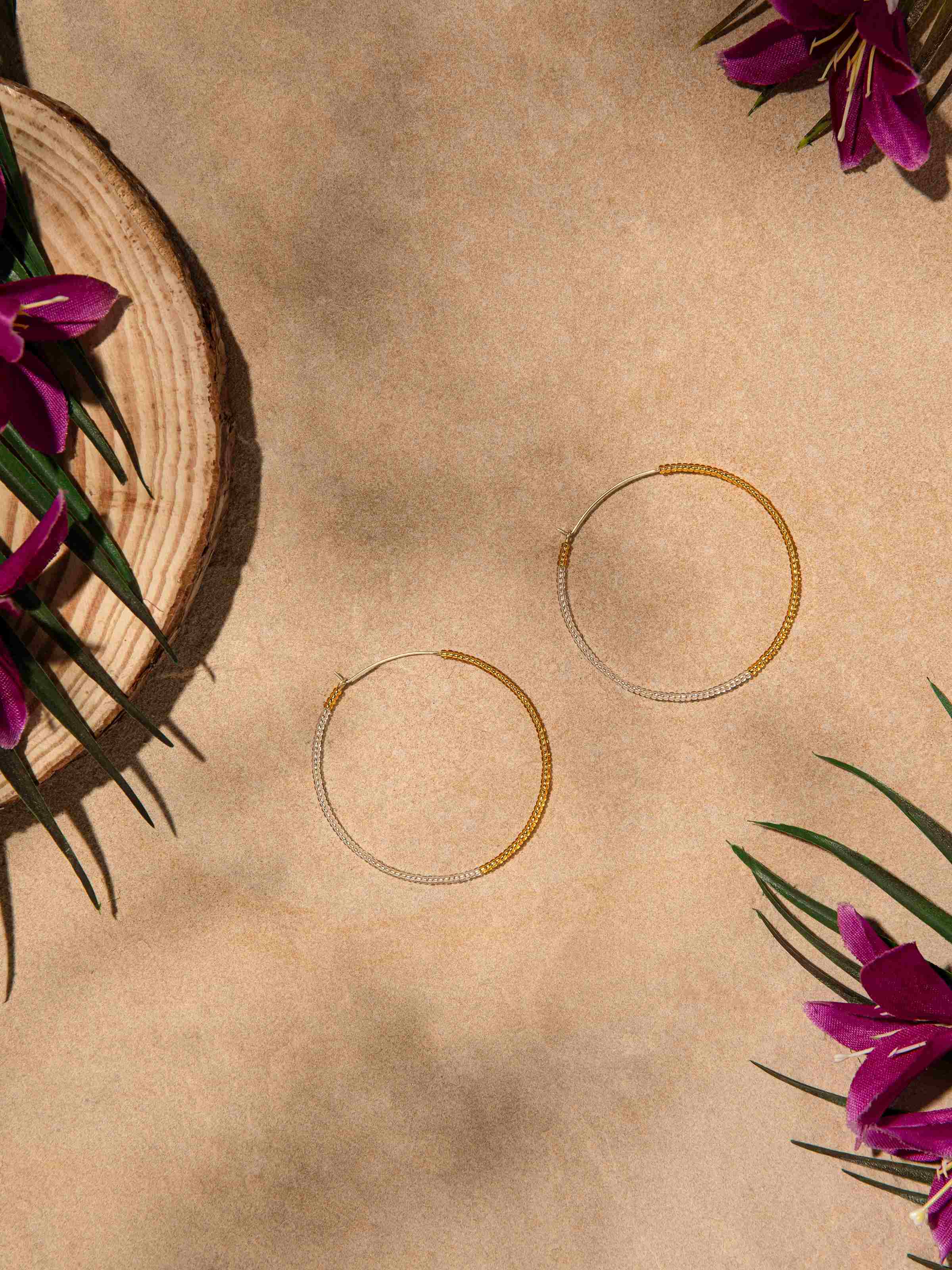 Side view of handcrafted hoop earrings highlighting their refined details