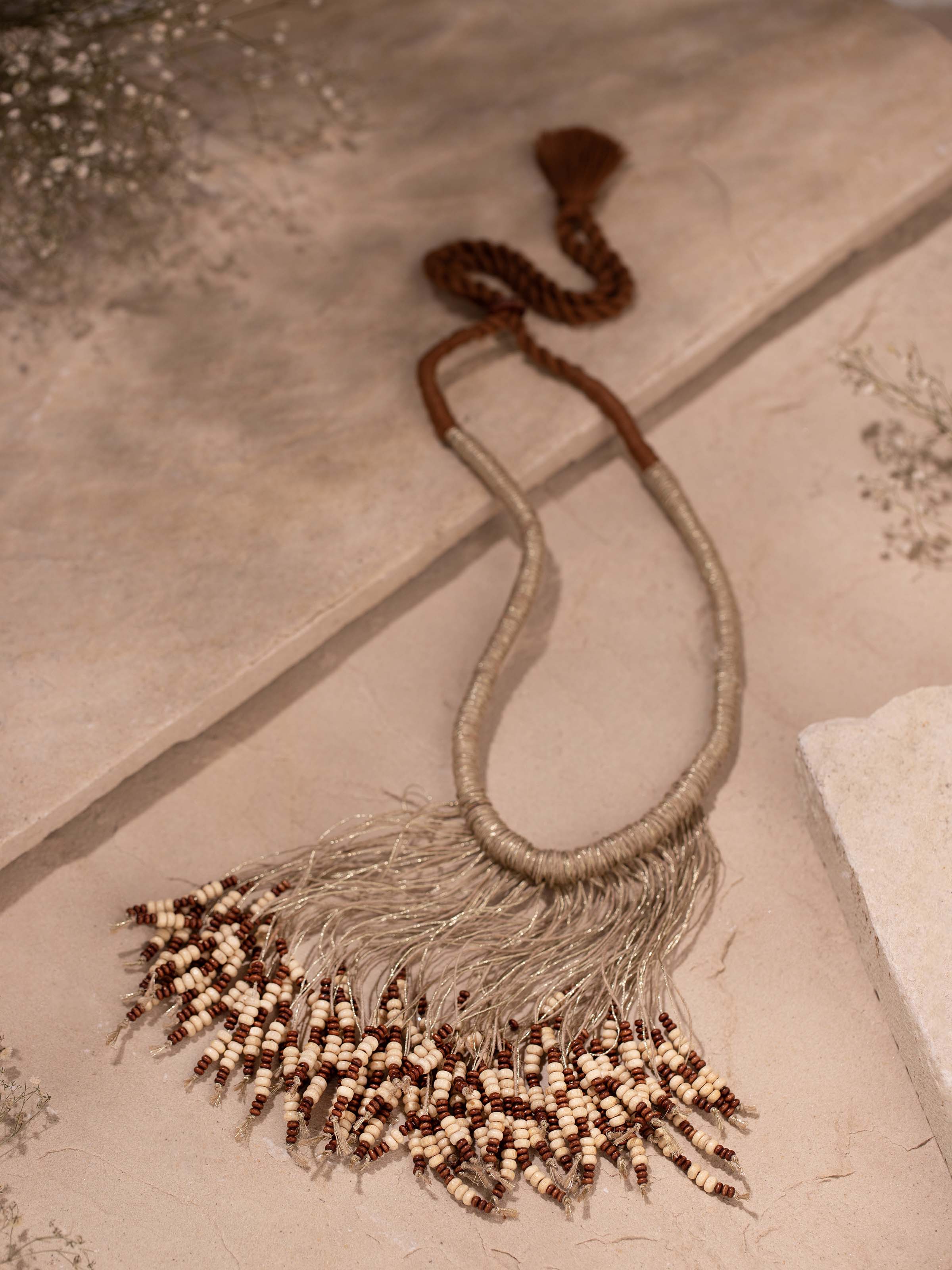 Side view of Jute long necklace highlighting the weave pattern