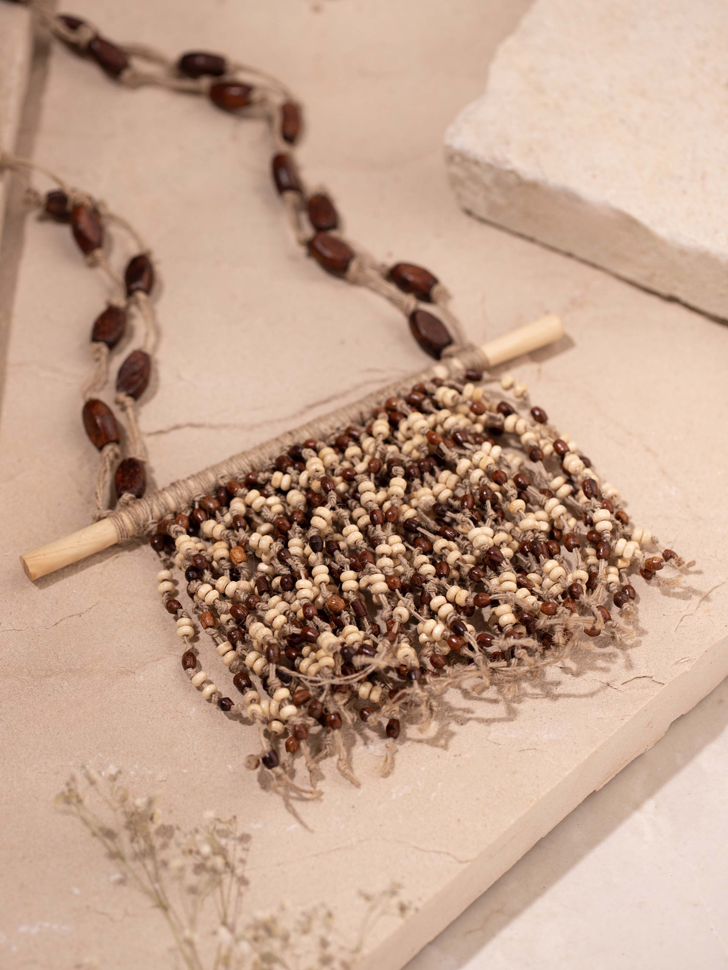 Detailed view of Jute Long Necklace from a distance showcasing its full design and texture.