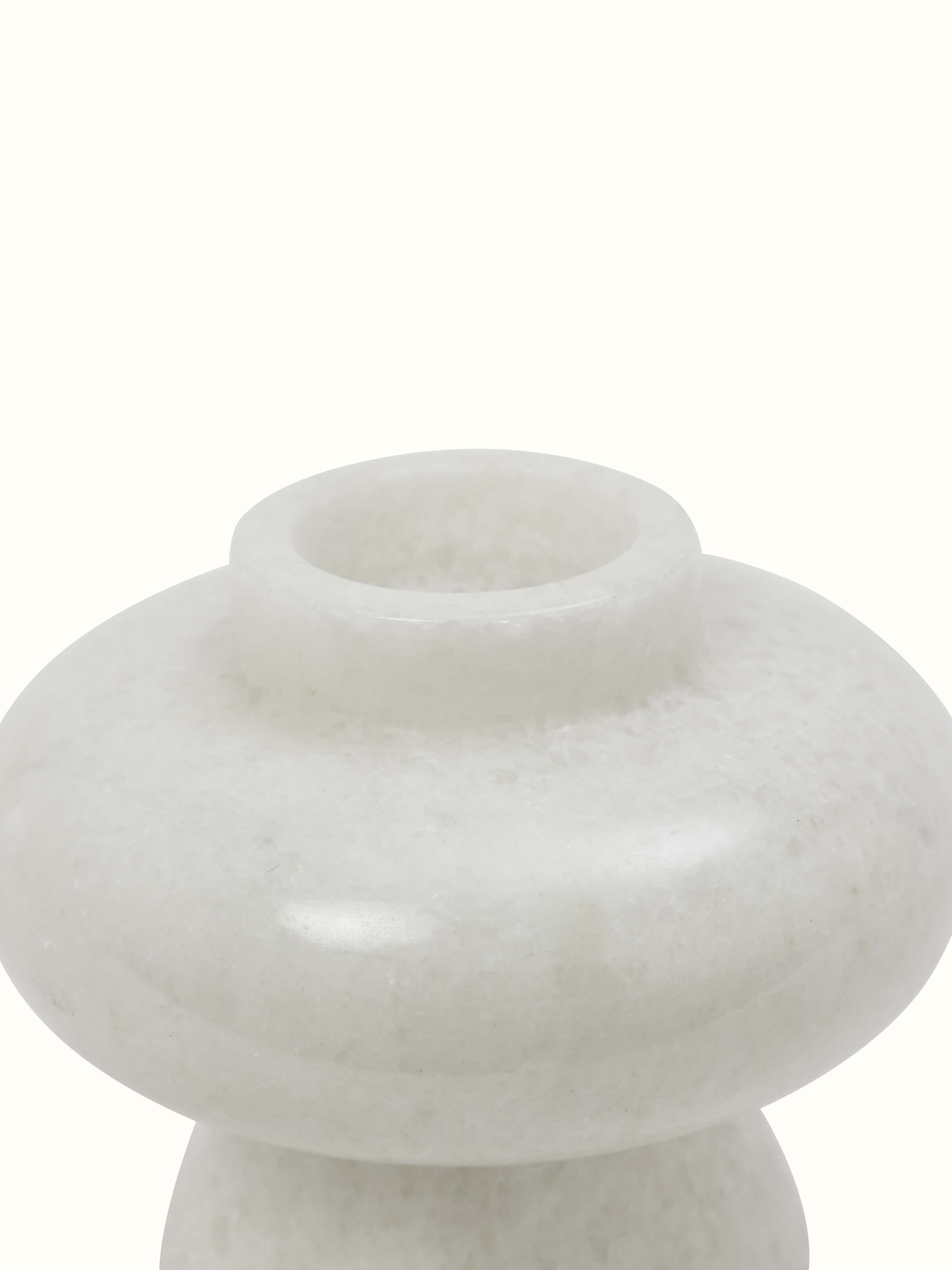 Close-up view of Carved marble tea light holder in white color focusing on the detailed marble carving and elegant design.