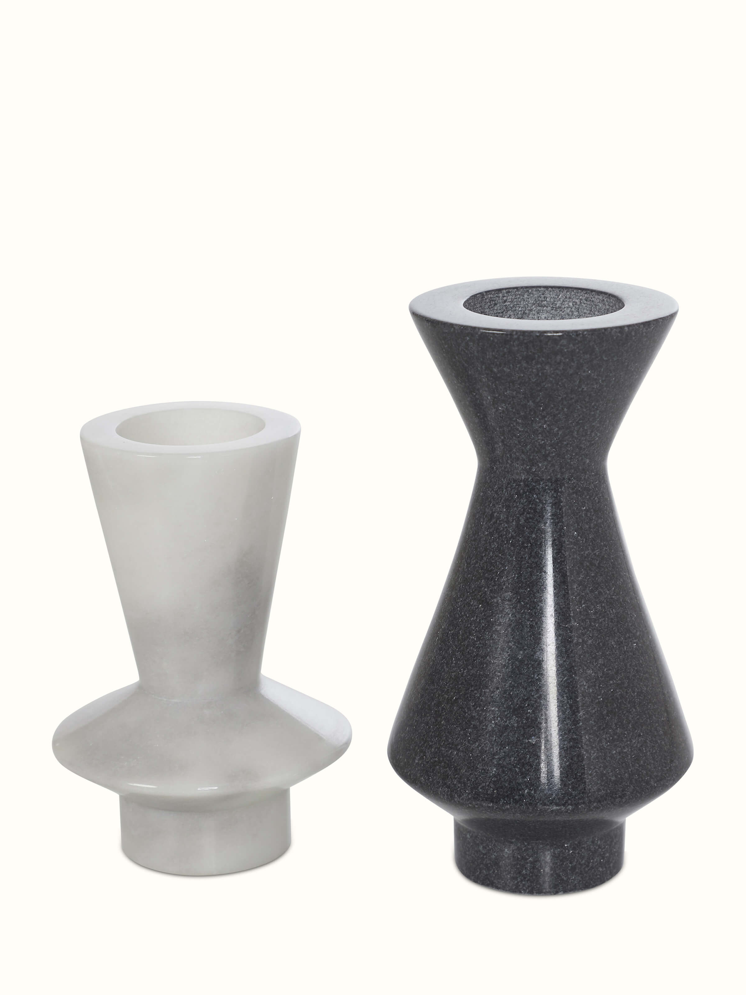 Set of 2 carved black marble candle holders with intricate detailing and elegant design.
