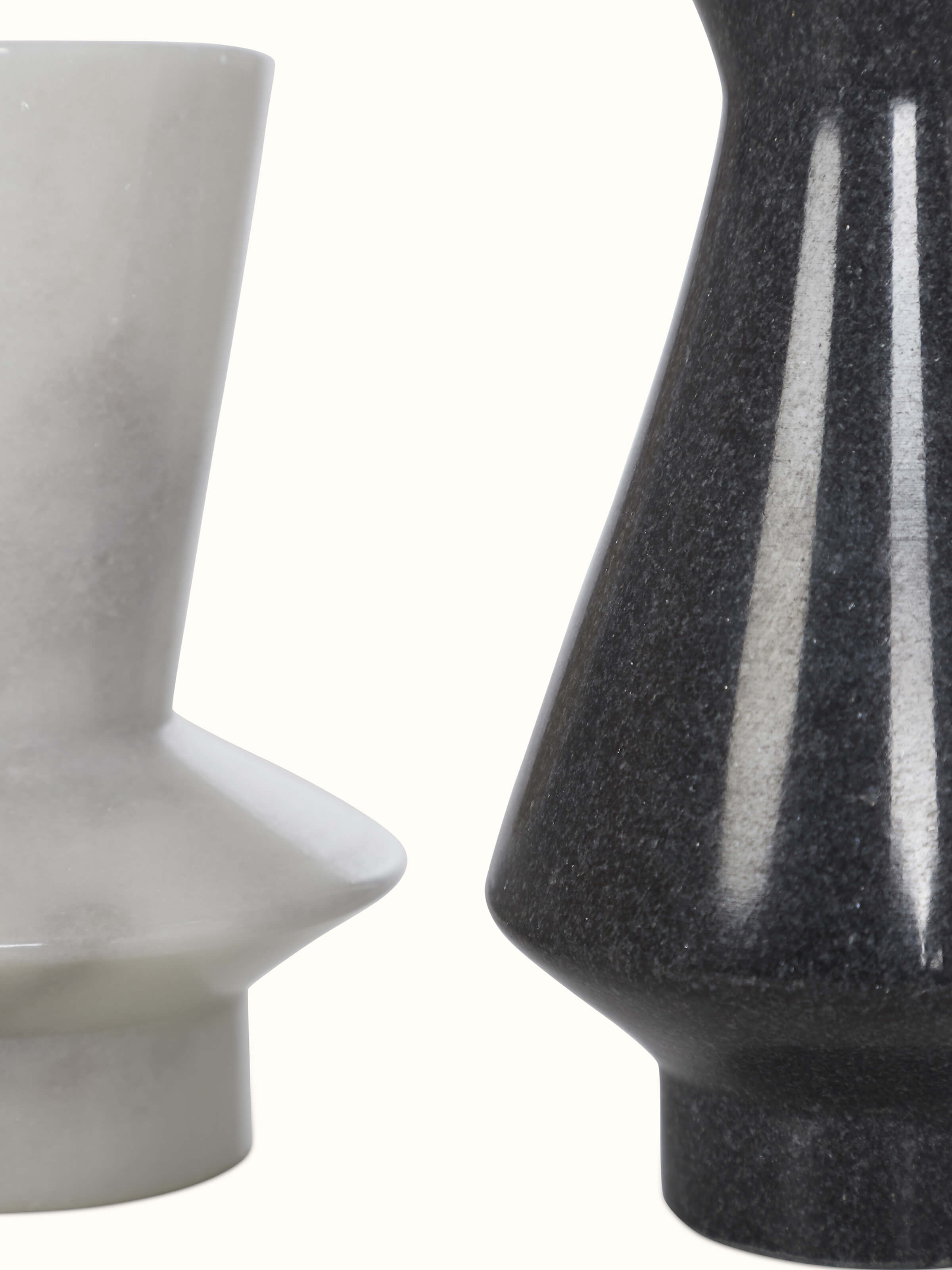 Top view of carved black marble candle holders, showcasing their craftsmanship and polished finish.