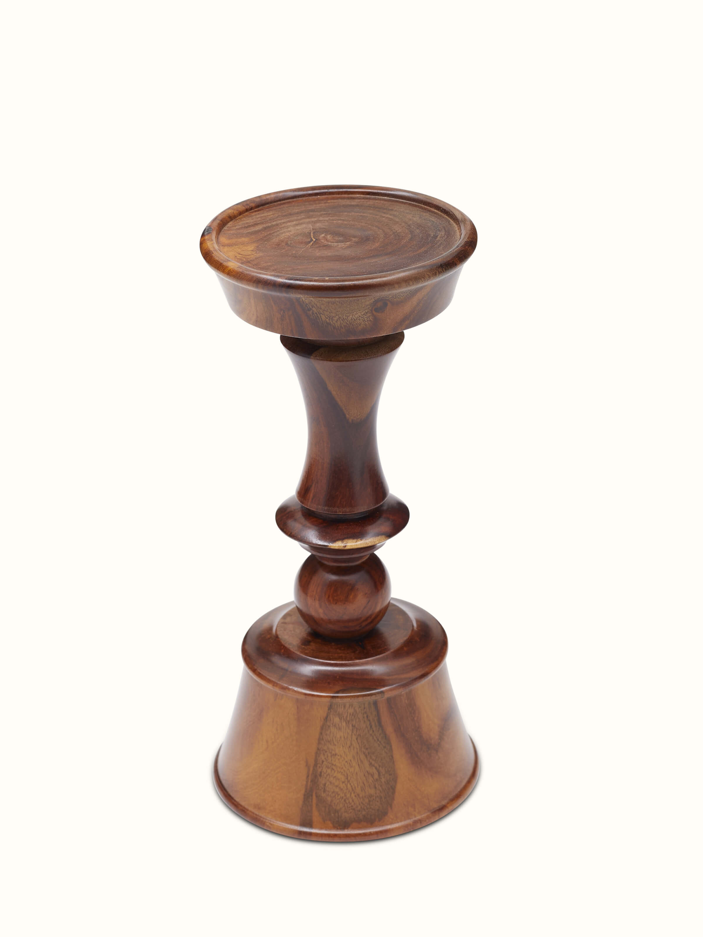Close-up of Sheesham wood candle holder focusing on intricate details and texture