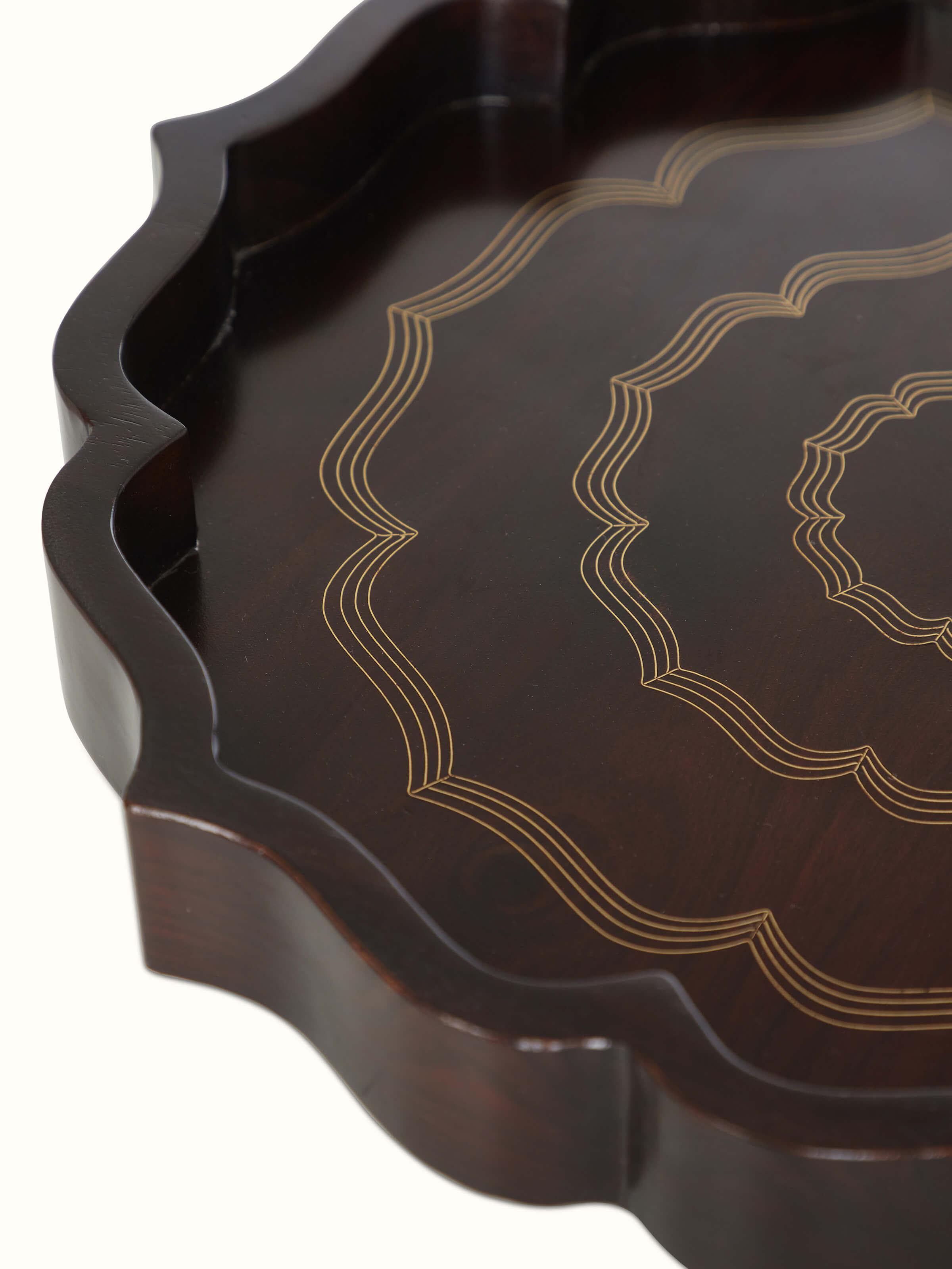 Close-up view of Tarkashi Sheesham wood & brass decorative tray in brown color showing its polished finish.