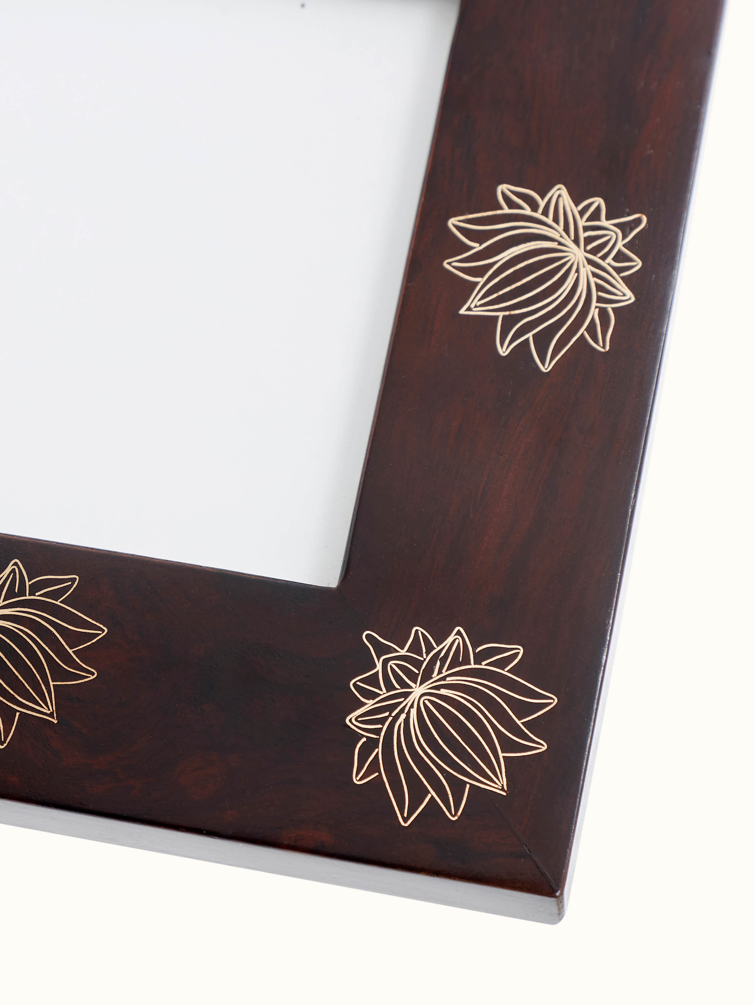 Close-up of Tarkashi sheesham wood & brass lotus photo frame emphasizing the texture and quality of the brass lotus design