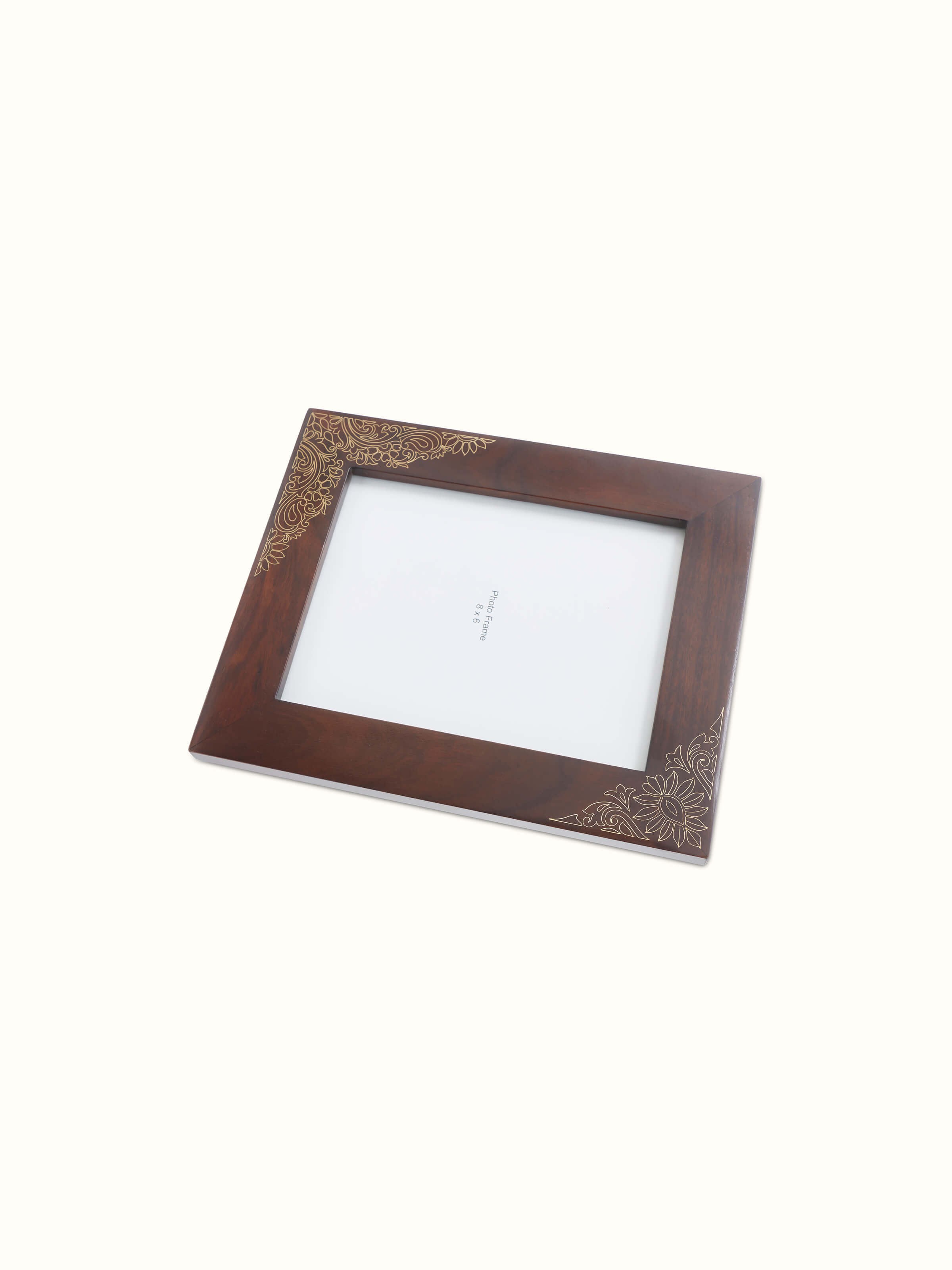 Detailed view of Tarkashi sheesham wood and brass photo frame with artistic inlays.