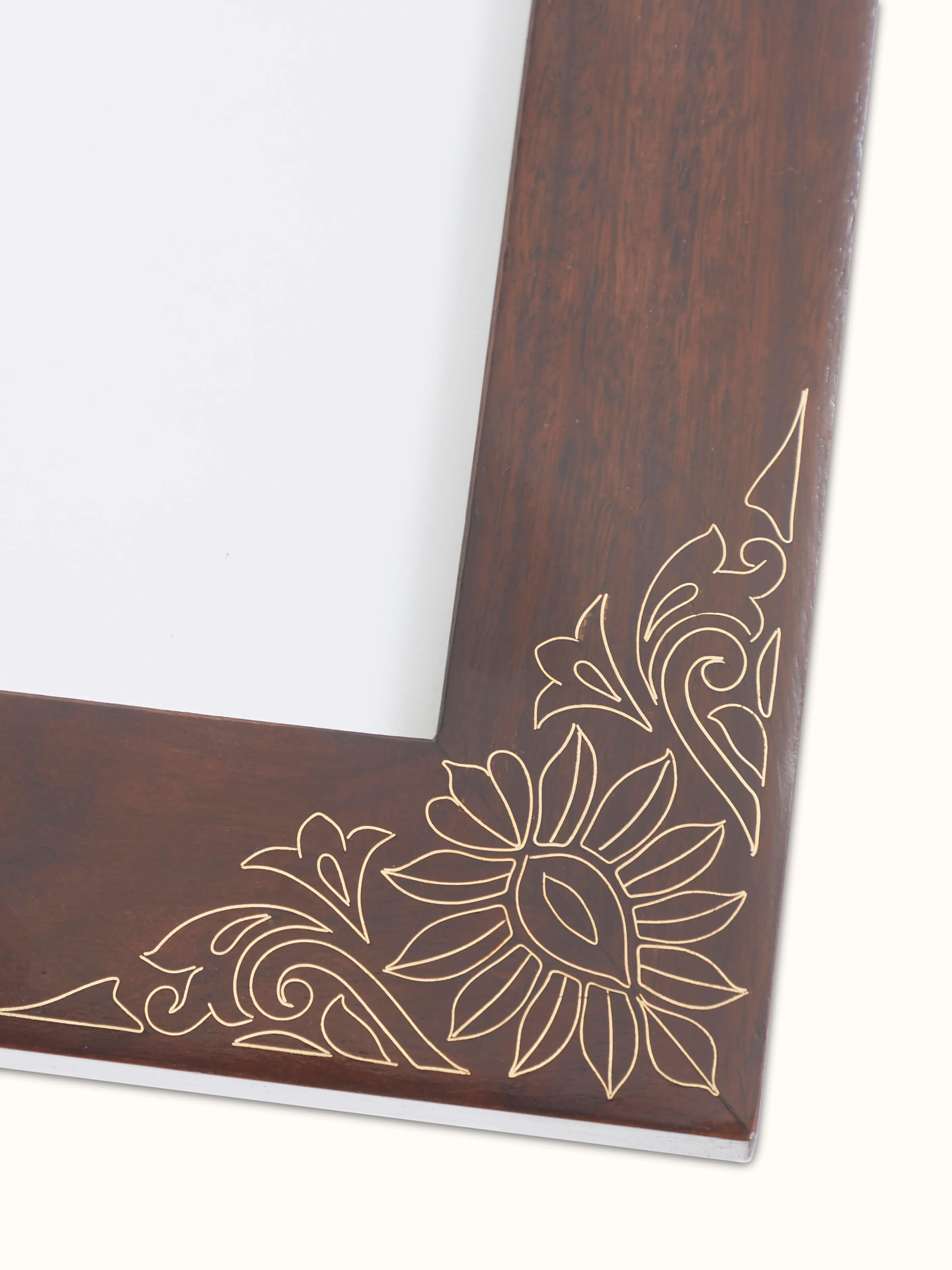 Side view of Tarkashi sheesham wood and brass photo frame in brown color with decorative elements.