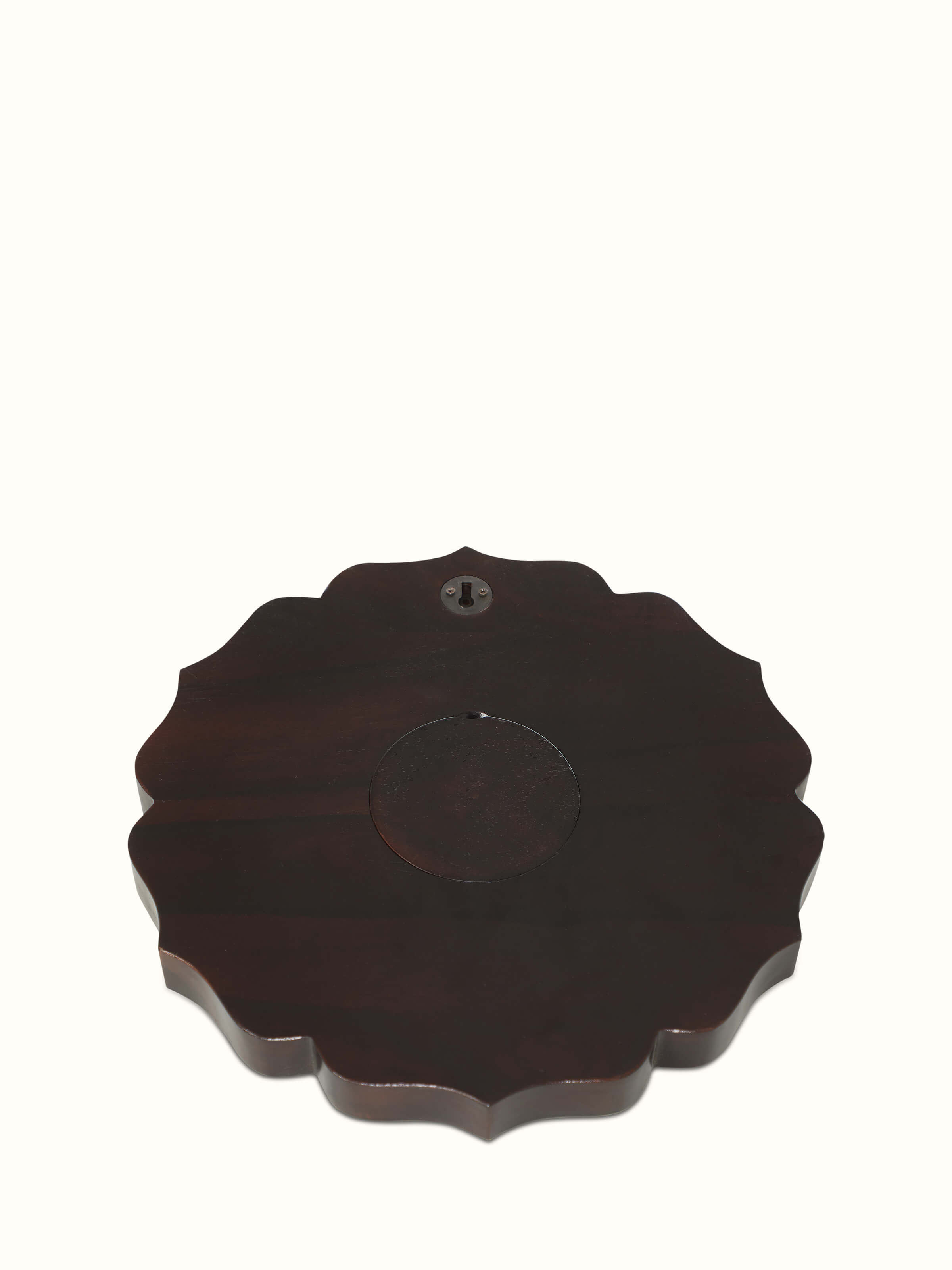 Detailed view of Handcrafted Tarkashi Sheesham Wood & Brass Wall Clock, showing the intricate brass inlays and wood finish