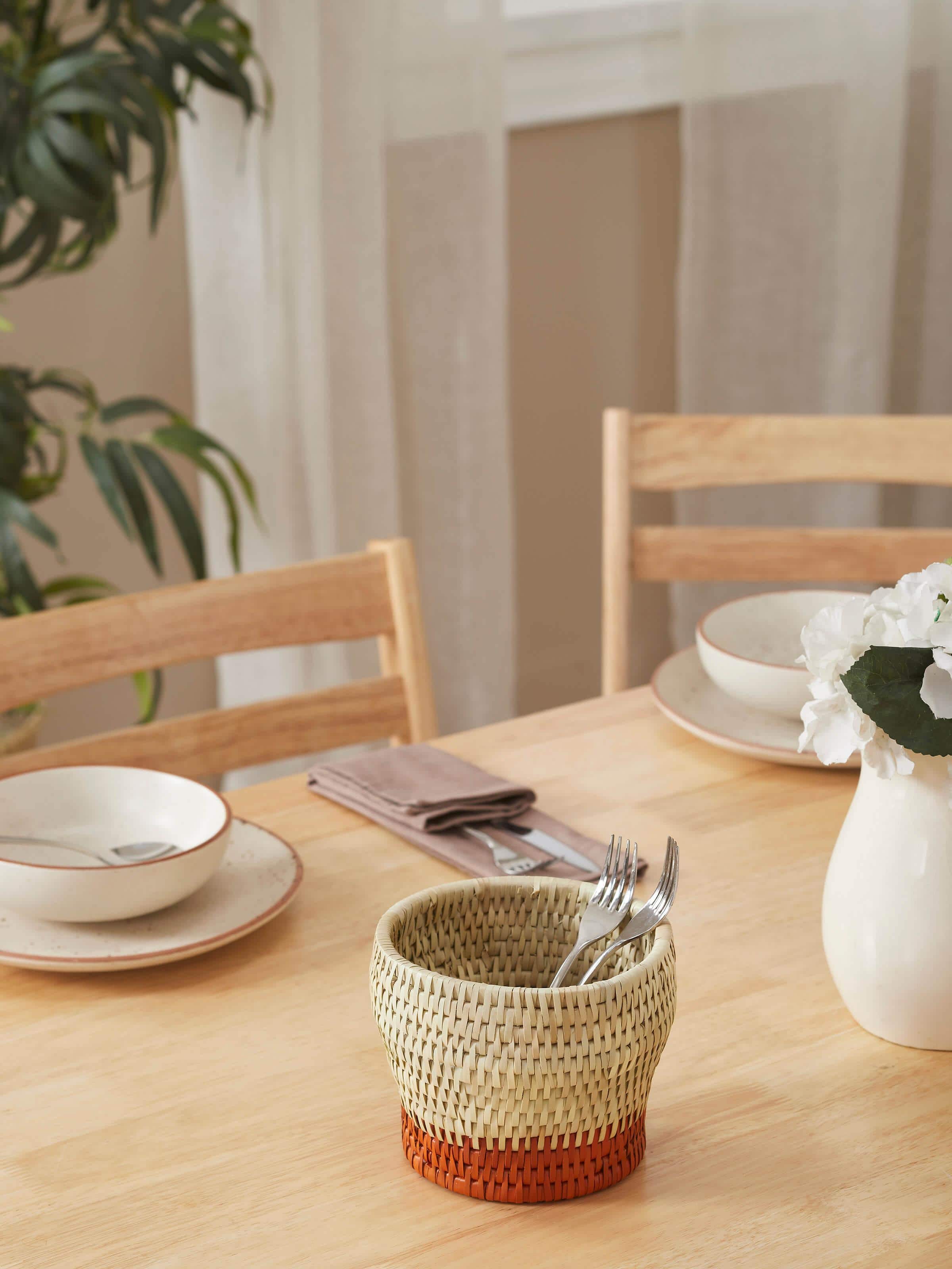 Side view of Palm Leaf Cutlery Holder highlighting its handcrafted details and sturdy structure