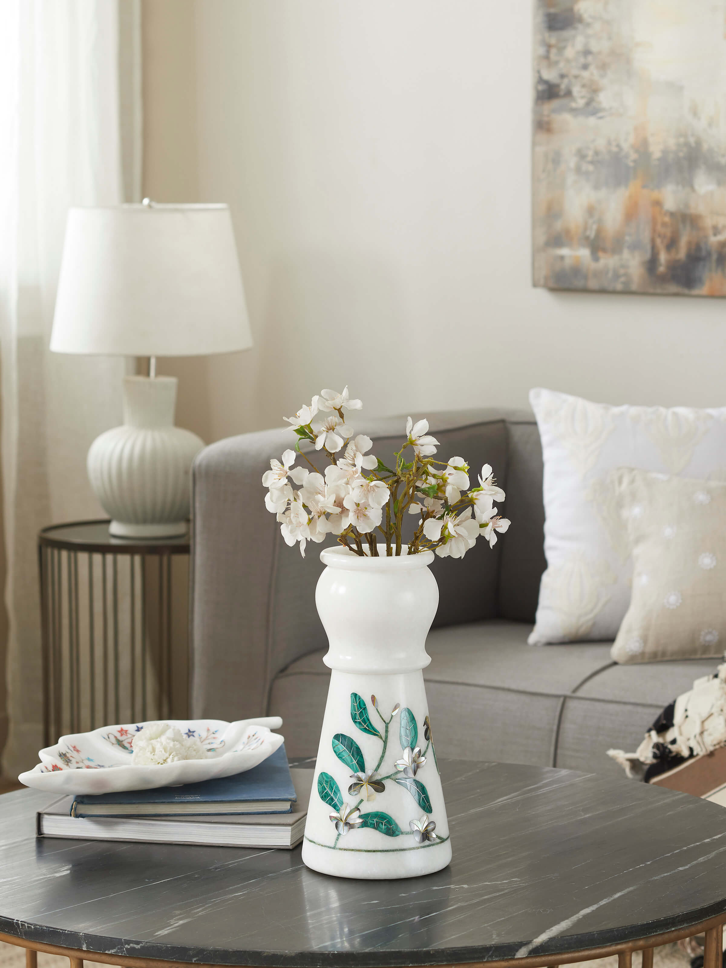 Side view of Pacchikari marble leaf floor vase highlighting the detailed marble craftsmanship and leaf pattern.