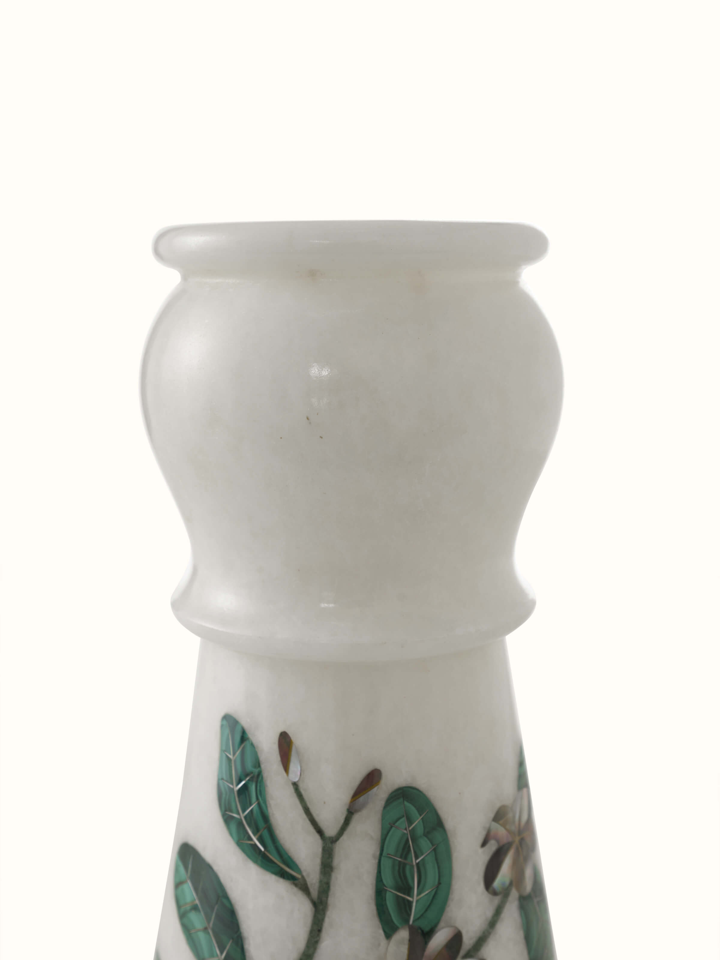 Angled view of Pacchikari marble leaf floor vase emphasizing the intricate leaf design and marble texture.