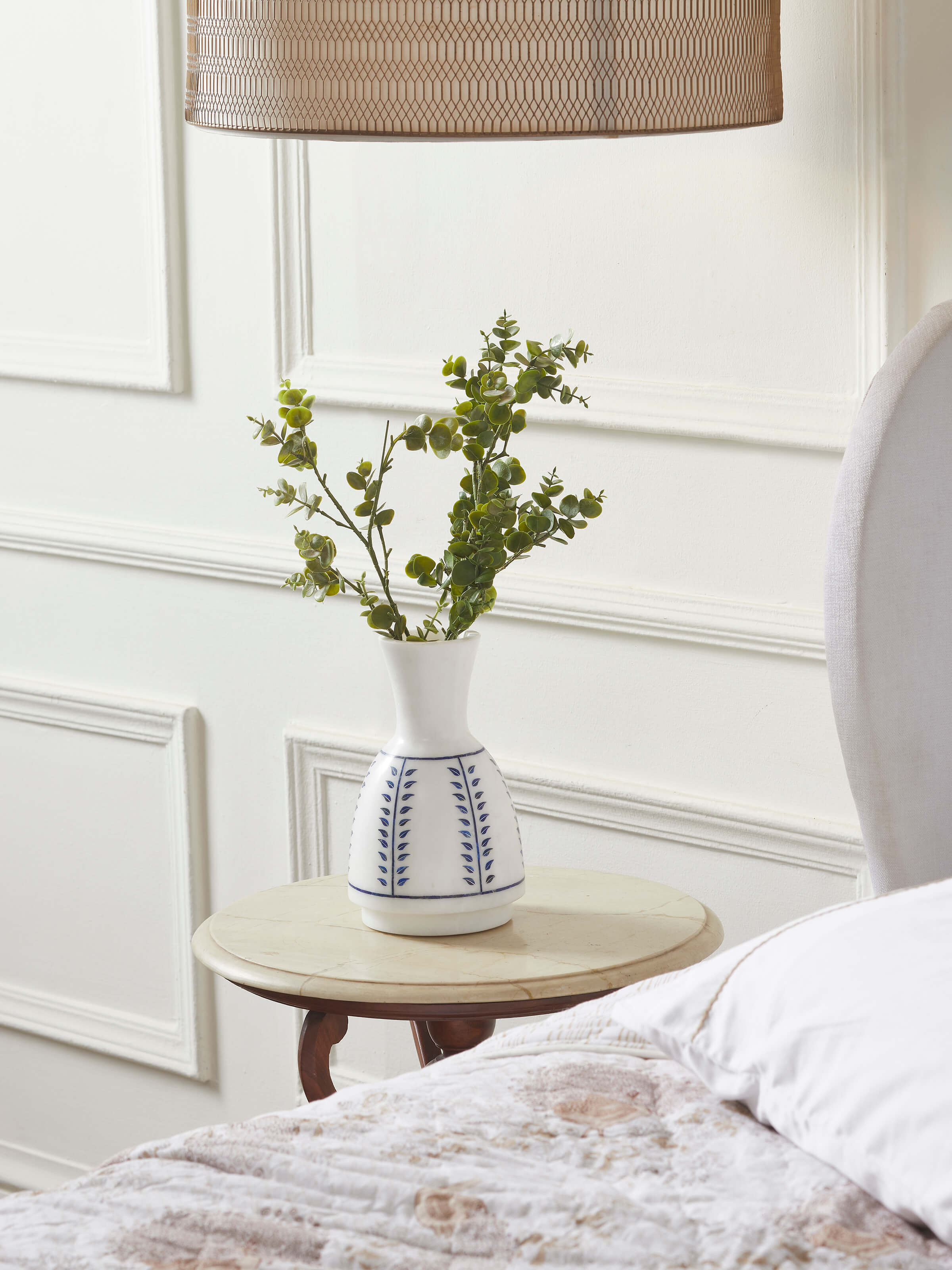 Side view of Pacchikari marble floor vase in white color highlighting its intricate detailing