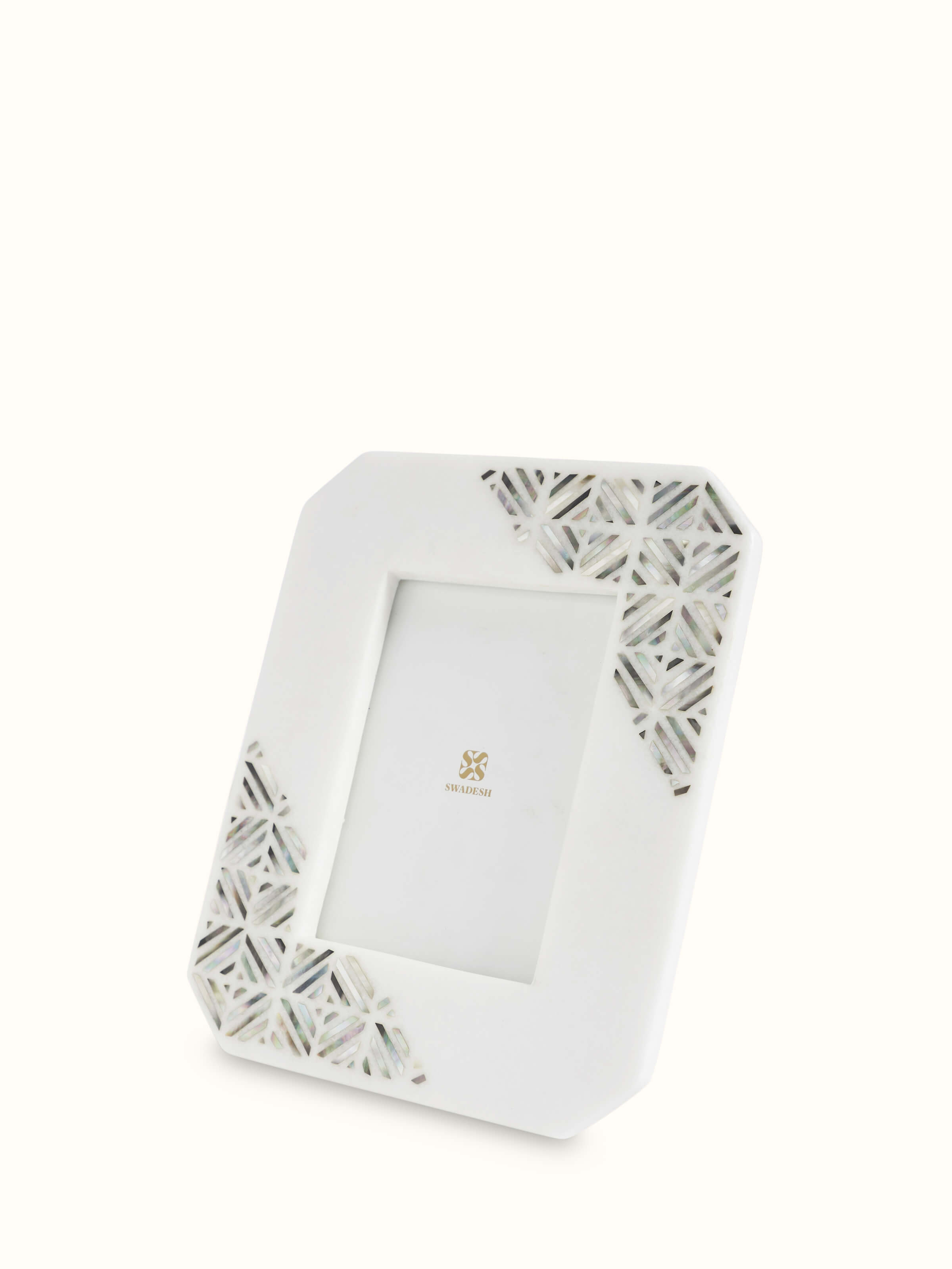 Close-up view of Pacchikari marble photo frames in white color focusing on marble quality and finish