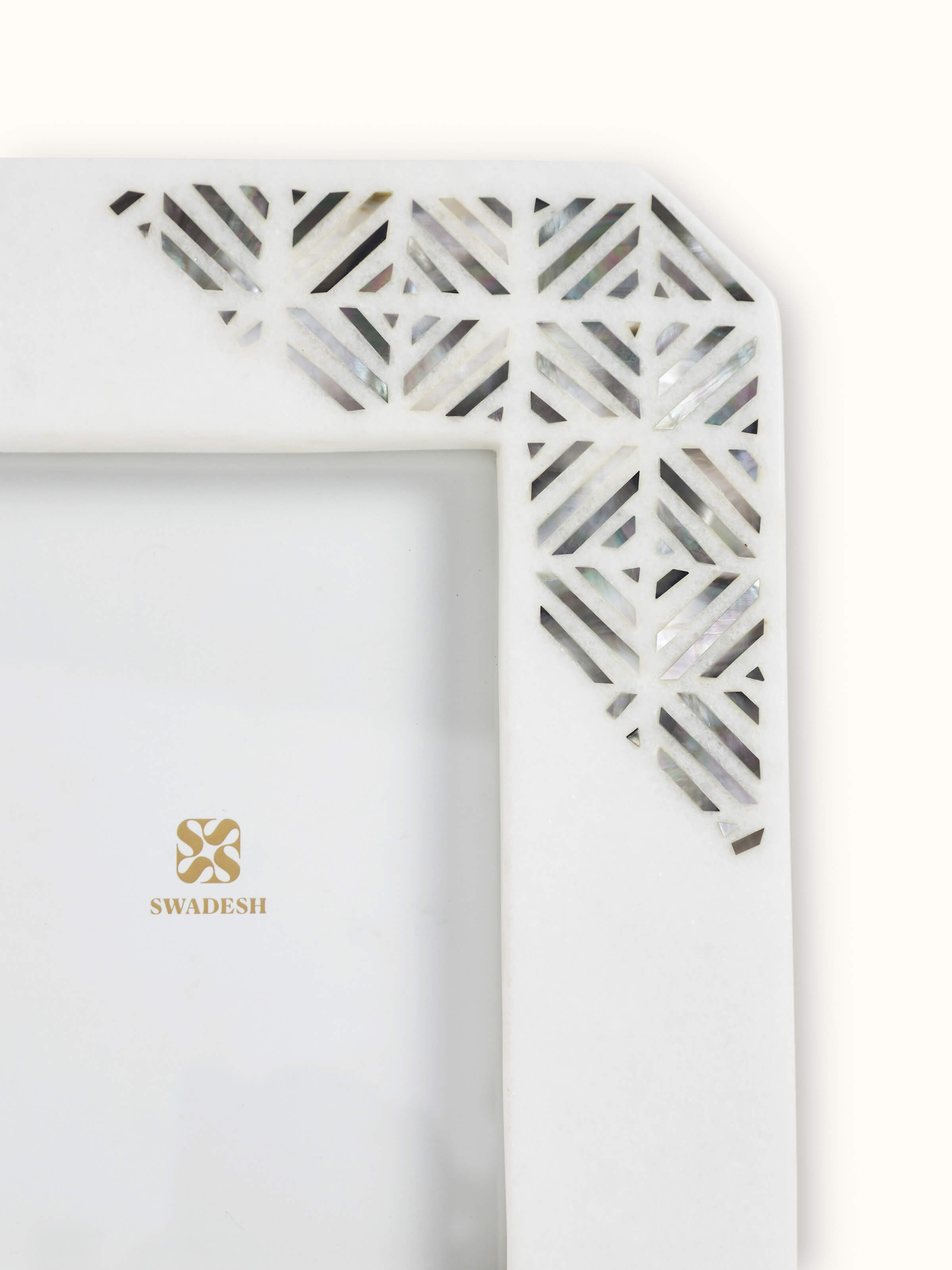 Detailed view of Pacchikari marble photo frames in white color highlighting high-quality marble texture
